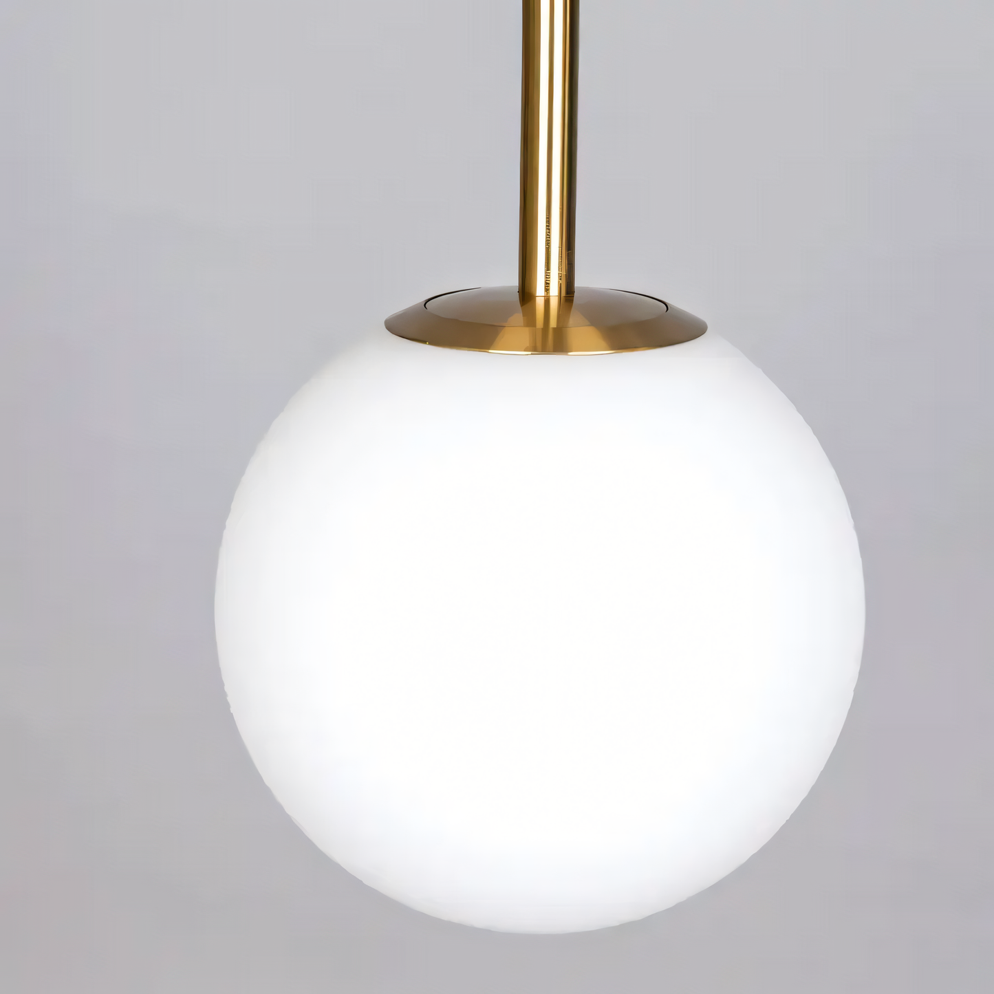 Gleaming gold metal frame of the Take A Trip (Gold) Marble Lamp