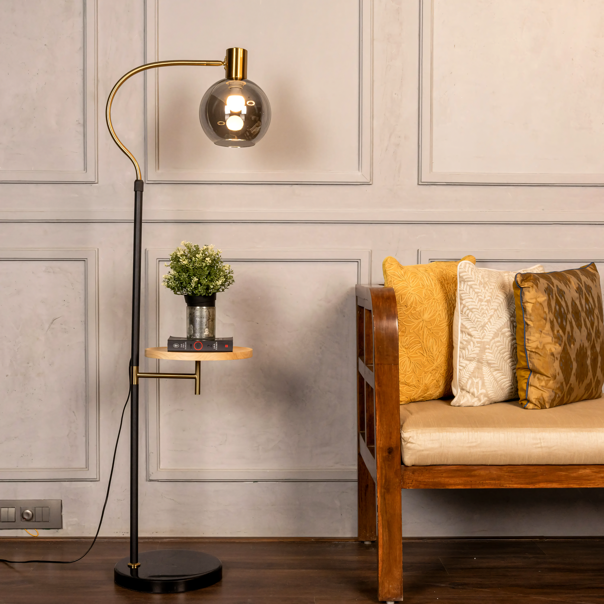 Detailed view of the Jet Lag (Marble) Floor Lamp's black marble base and metal frame