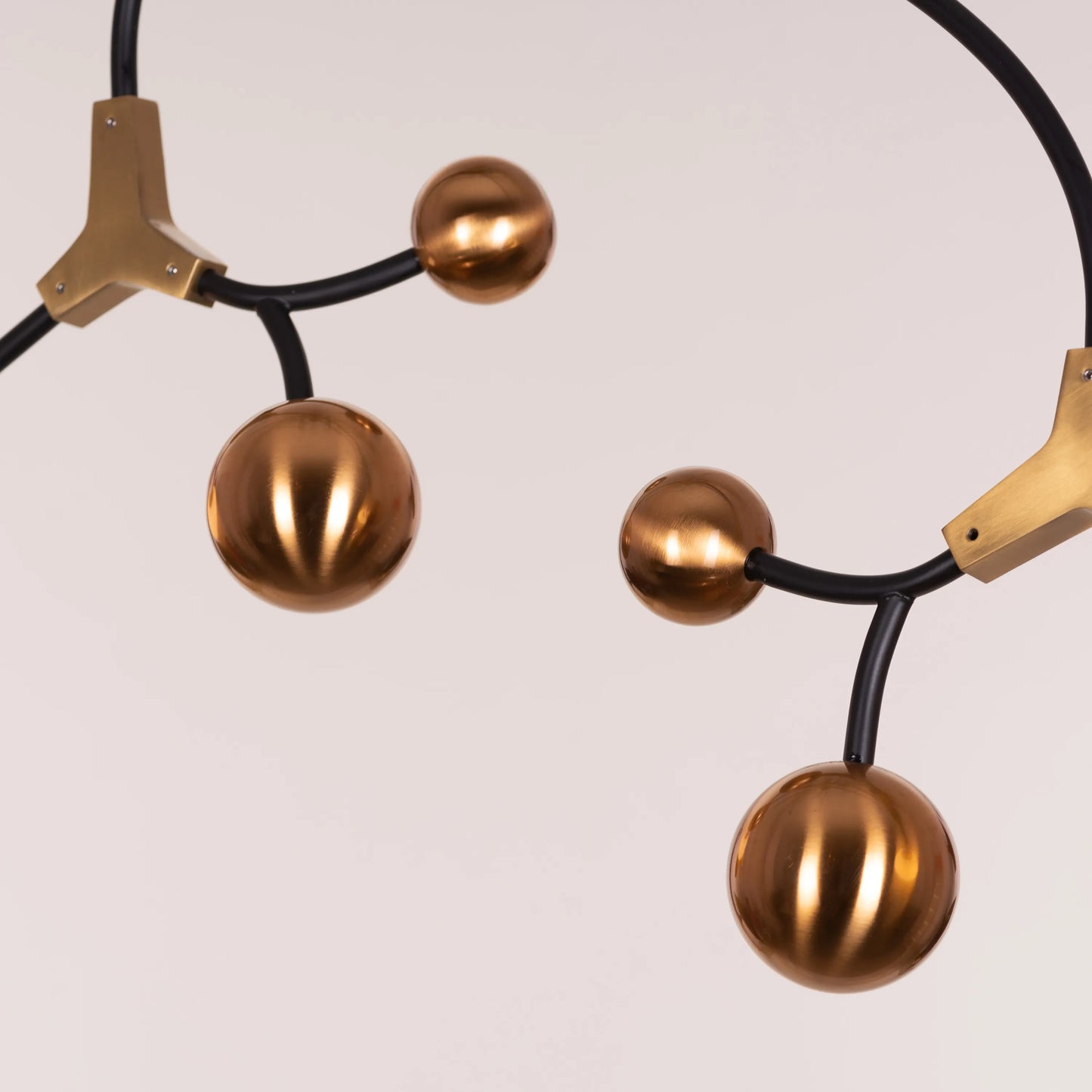 Owe & Awe Pendant Light: A sleek black and gold pendant light fixture with contemporary design.