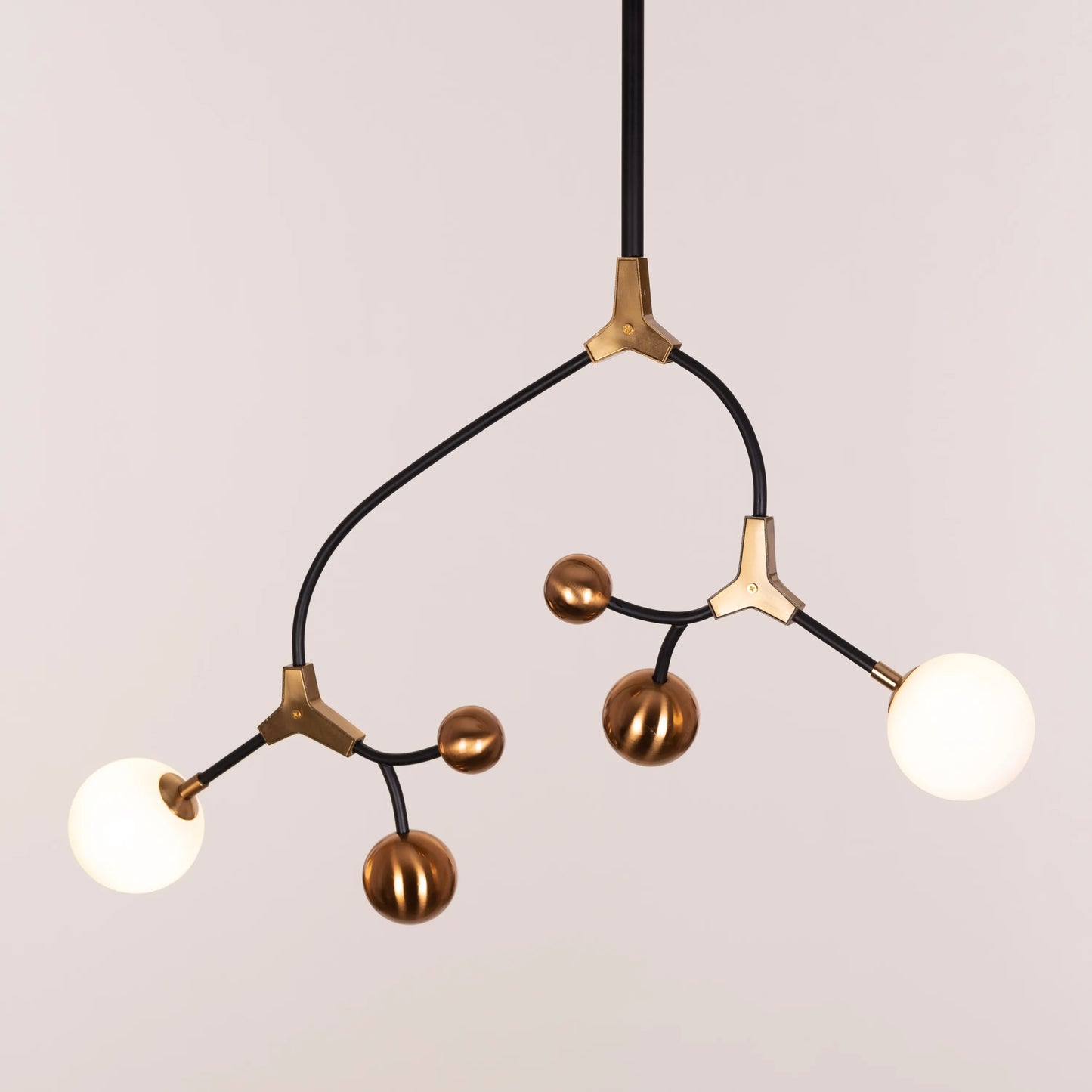 Owe & Awe Pendant Light: A sleek black and gold pendant light fixture with contemporary design.