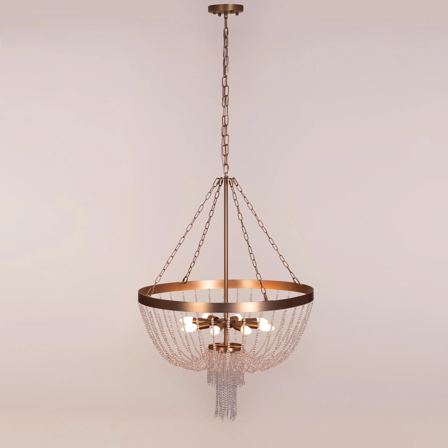 Elegant All That Glows Crystal Chandelier hanging in a modern dining room.