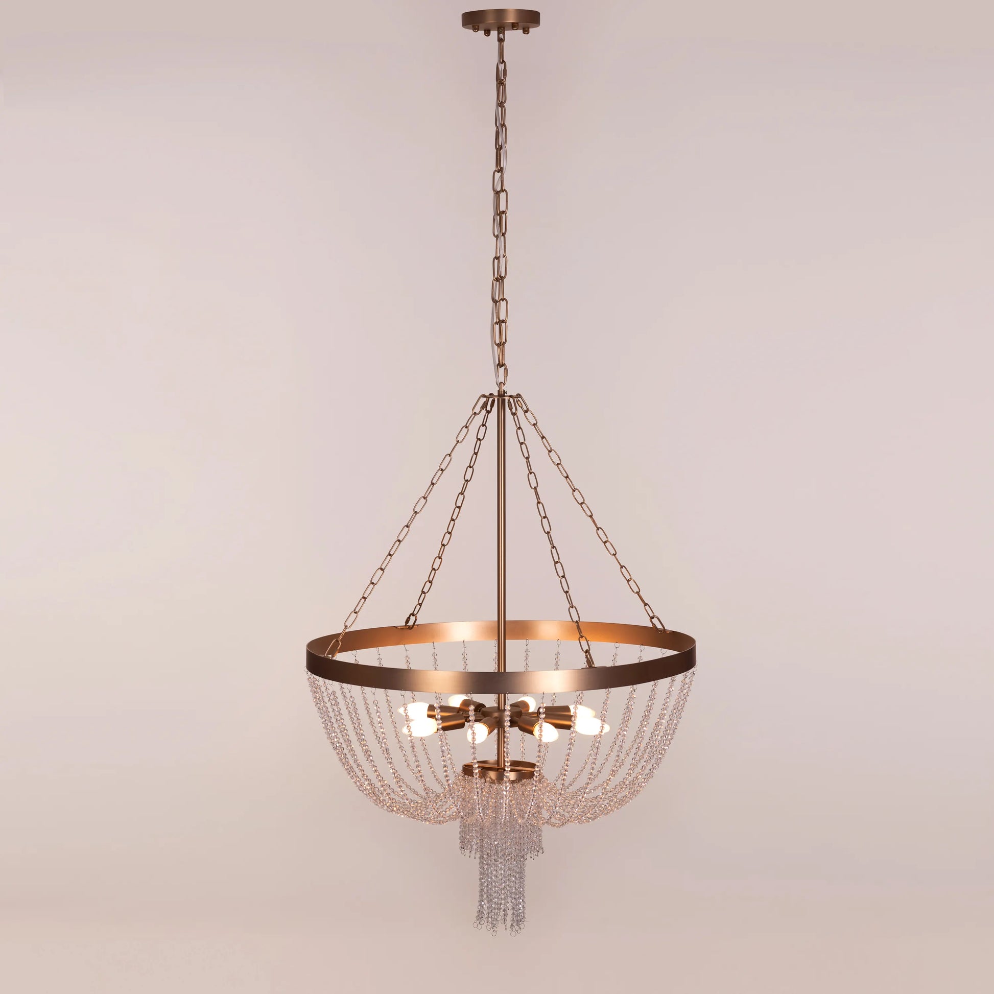 Elegant All That Glows Crystal Chandelier hanging in a modern dining room.