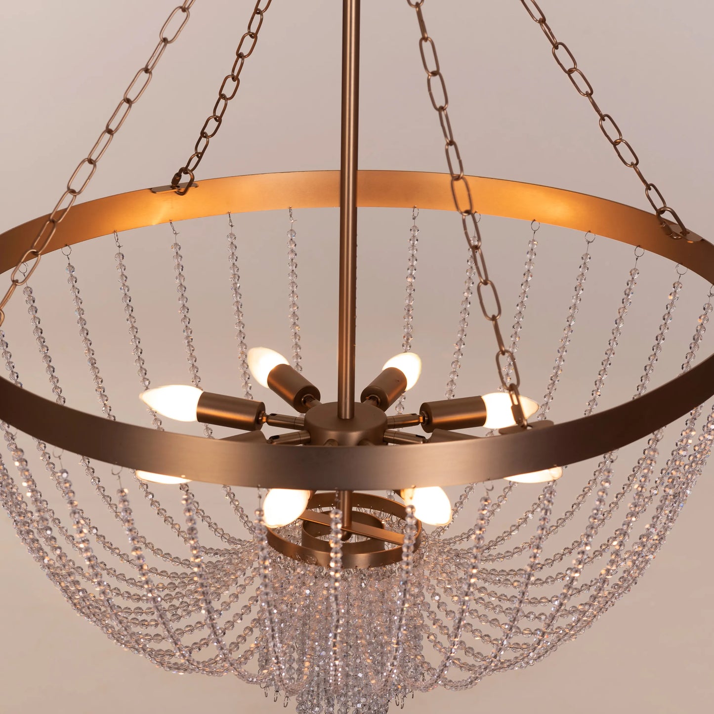 Elegant All That Glows Crystal Chandelier hanging in a modern dining room.