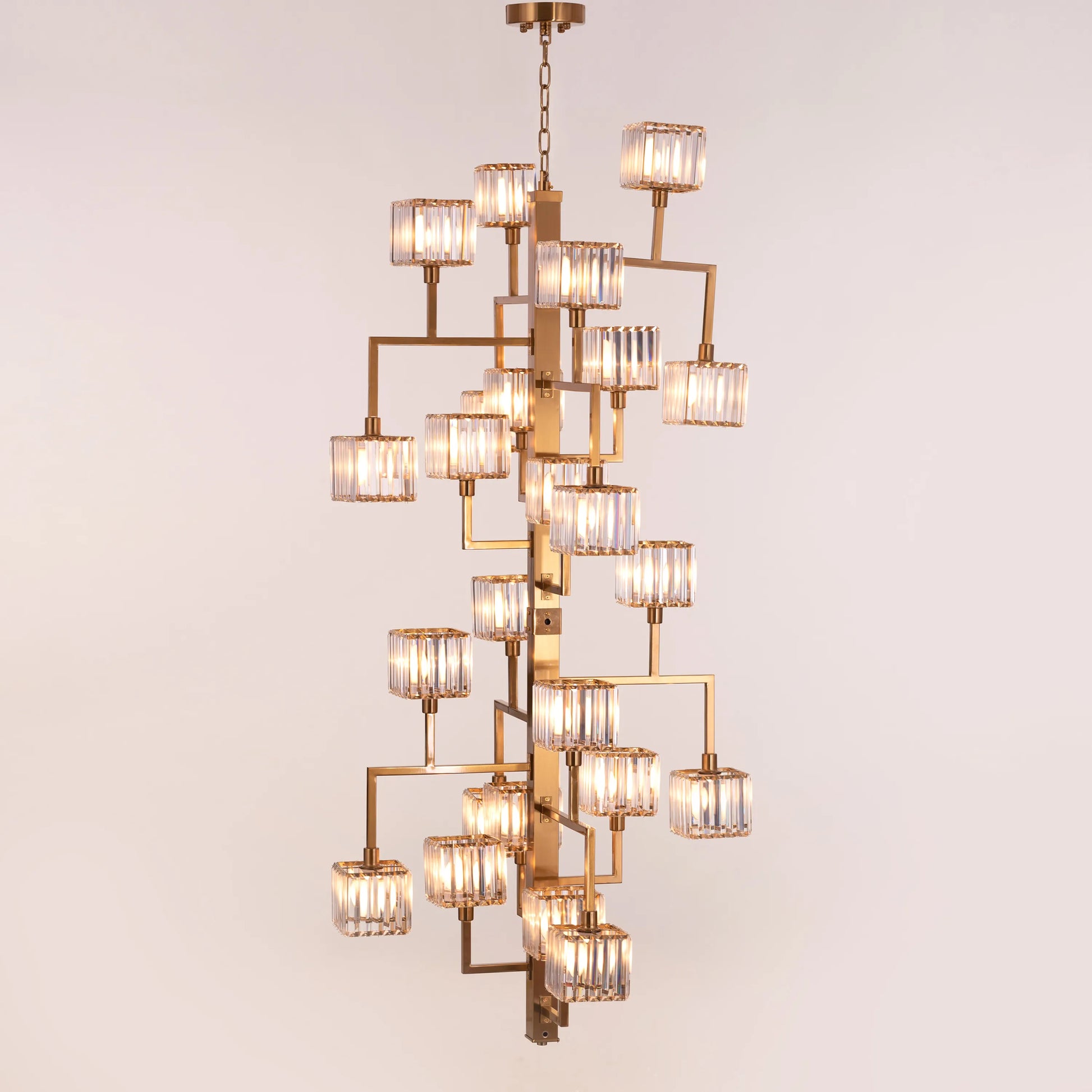 Watch The Throne large vertical gold and crystal chandelier illuminating a grand multi-story foyer with its cascading light