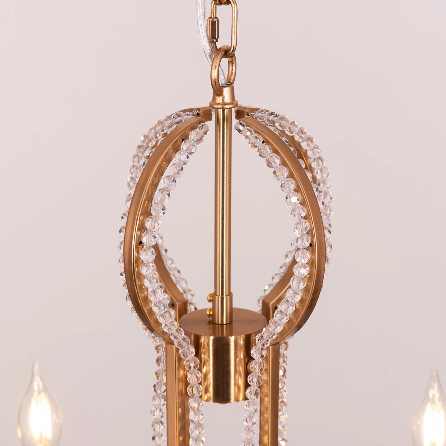 Large gold and crystal chandelier with cascading tiers resembling a fountain of light