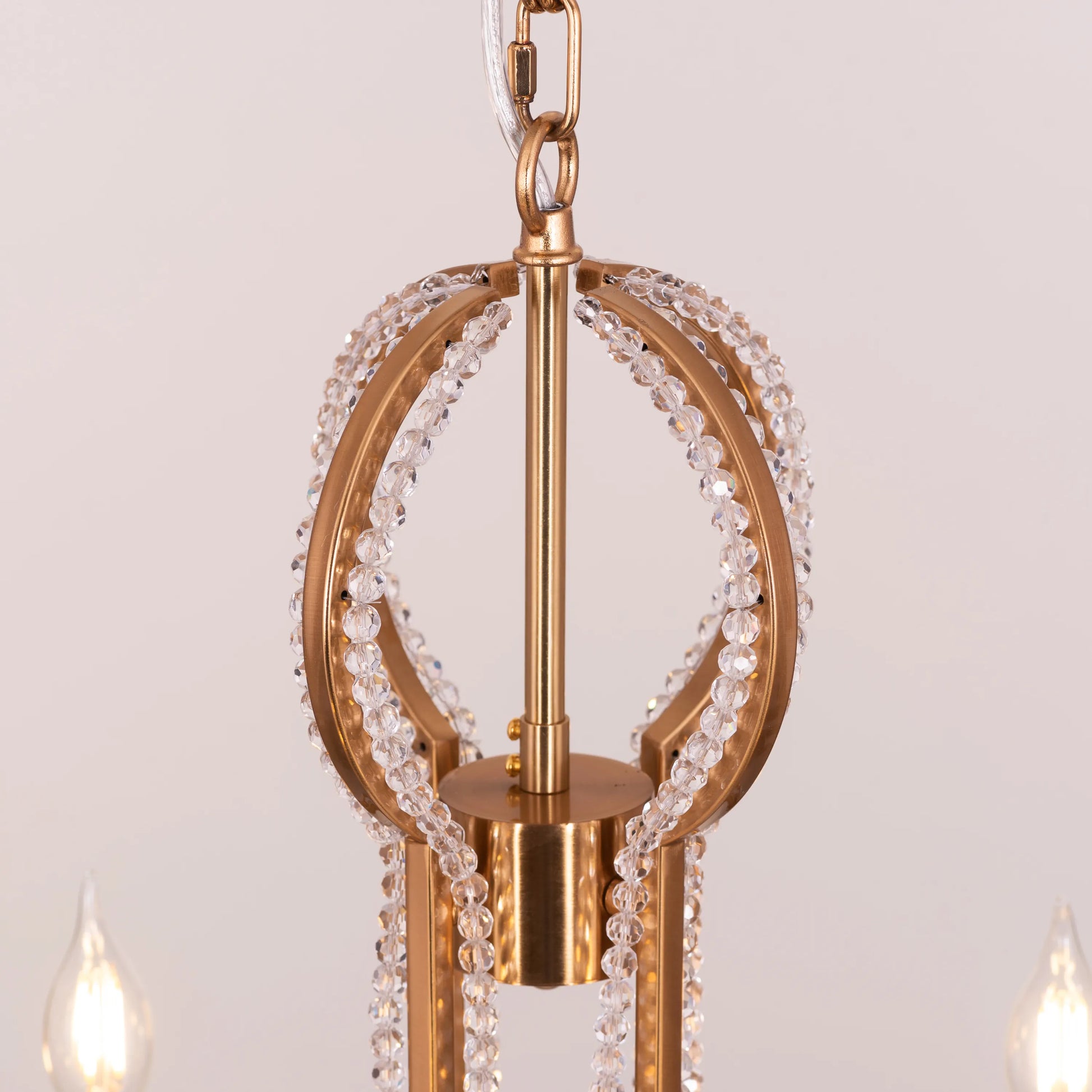 Large gold and crystal chandelier with cascading tiers resembling a fountain of light