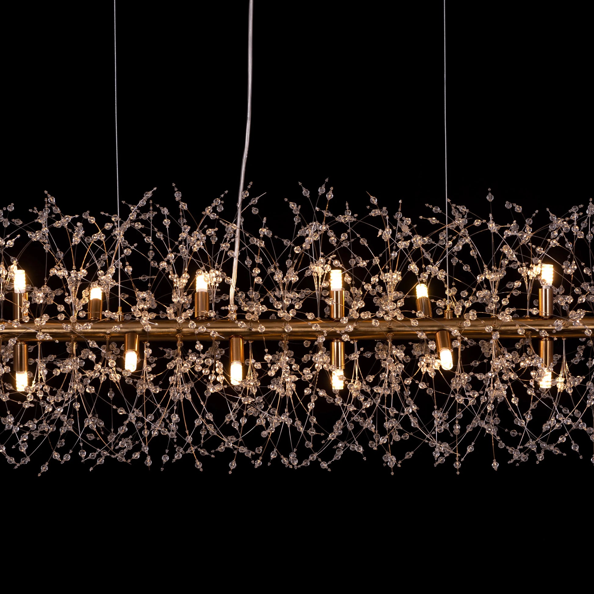 Touch The Clouds Gold Rectangular Crystal Chandelier in an opulent living room setting