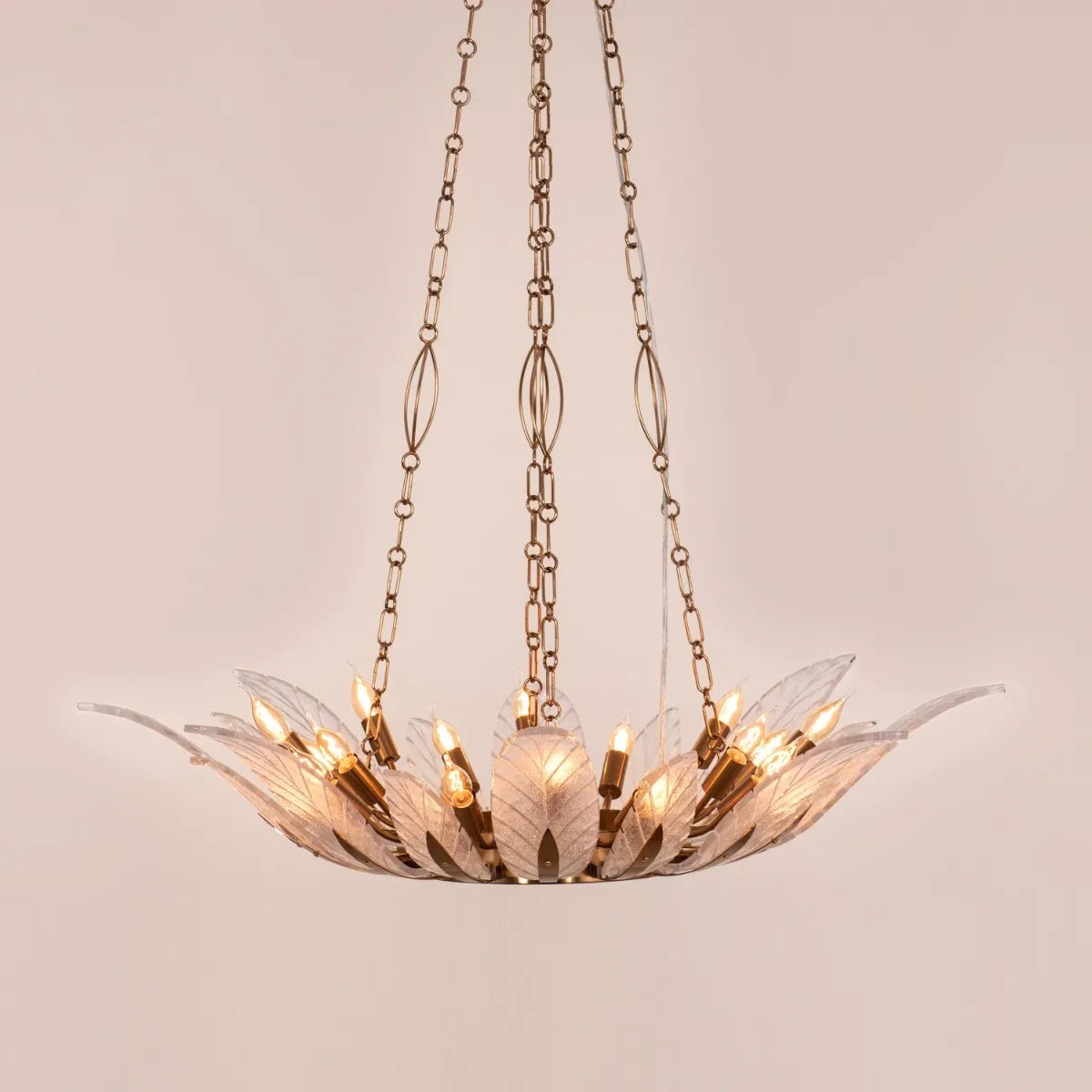 Trance Glass Chandelier suspended in a grand foyer, its gold framework and glass elements creating a dazzling display.