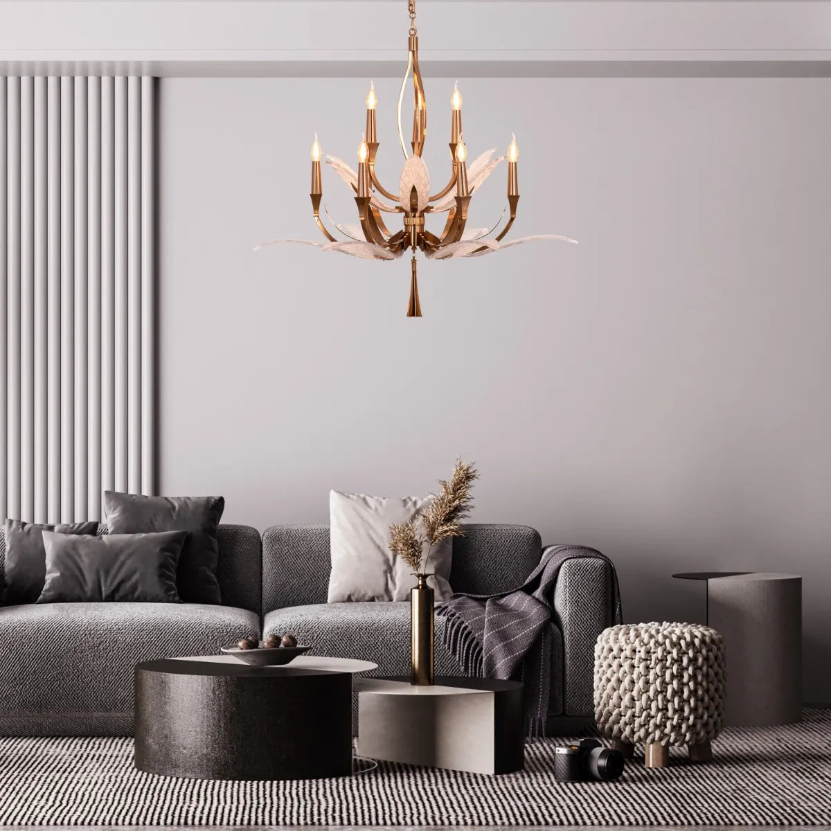 Medium-sized gold chandelier with unique glass elements, suspended in a contemporary living room