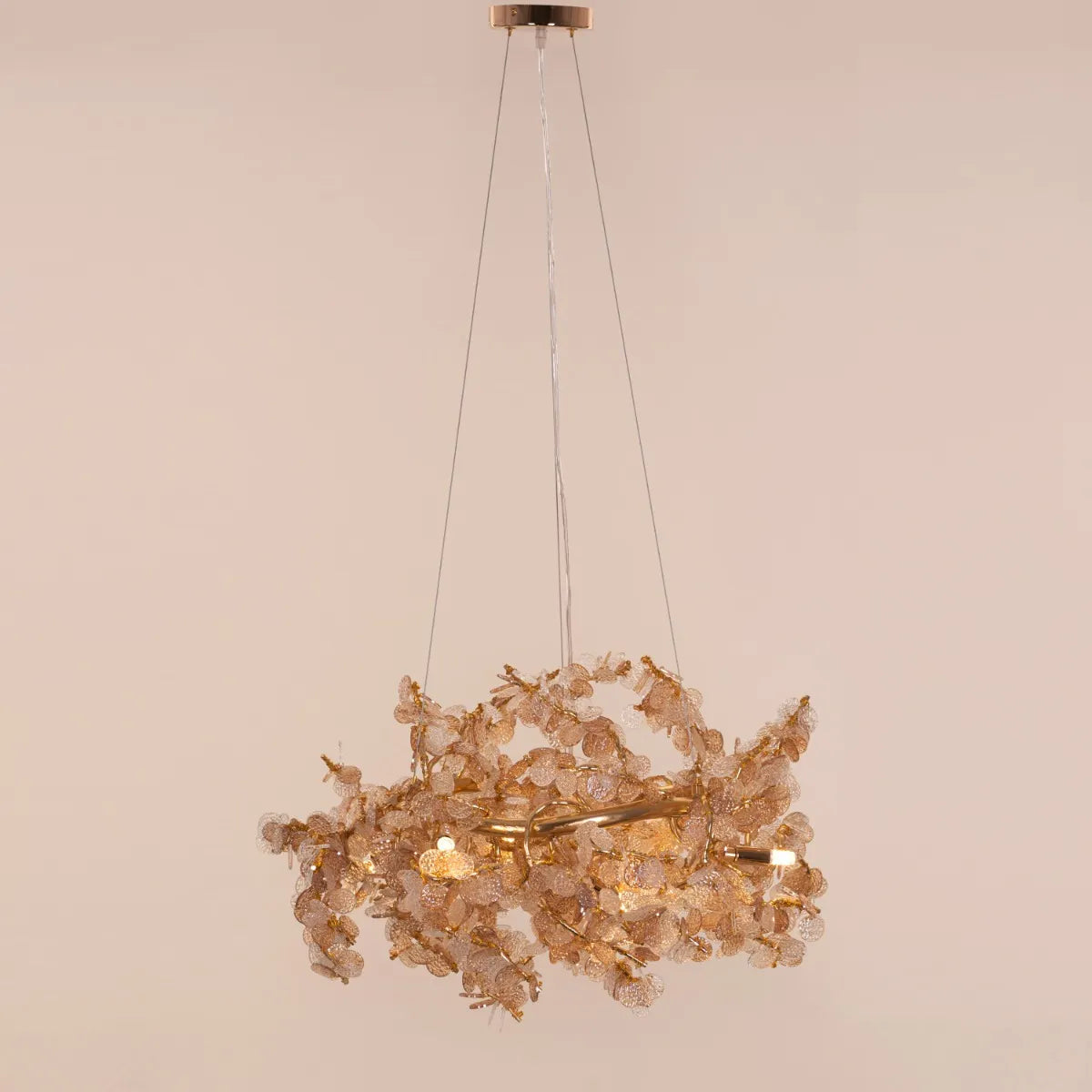 California Tree Branch Crystal Chandelier illuminating a luxurious dining room.