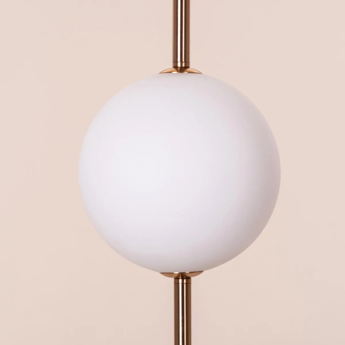 A modern pendant light named 'Peacemaker,' featuring a sleek gold finish and built-in LED lighting. The minimalist design showcases clean lines and a refined silhouette, while the integrated LED provides bright, energy-efficient illumination. This elegant pendant adds a touch of sophistication and warmth to any space, making it a perfect addition to contemporary decor