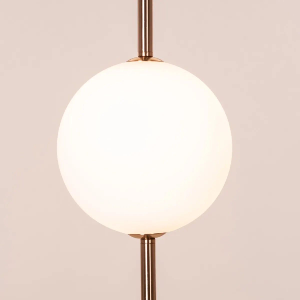 A modern pendant light named 'Peacemaker,' featuring a sleek gold finish and built-in LED lighting. The minimalist design showcases clean lines and a refined silhouette, while the integrated LED provides bright, energy-efficient illumination. This elegant pendant adds a touch of sophistication and warmth to any space, making it a perfect addition to contemporary decor