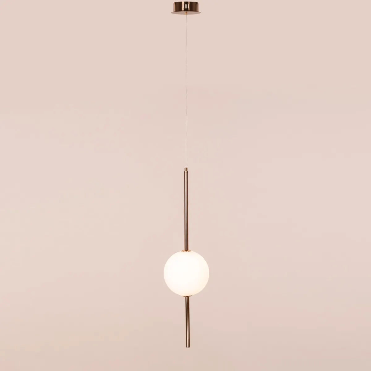 A modern pendant light named 'Peacemaker,' featuring a sleek gold finish and built-in LED lighting. The minimalist design showcases clean lines and a refined silhouette, while the integrated LED provides bright, energy-efficient illumination. This elegant pendant adds a touch of sophistication and warmth to any space, making it a perfect addition to contemporary decor