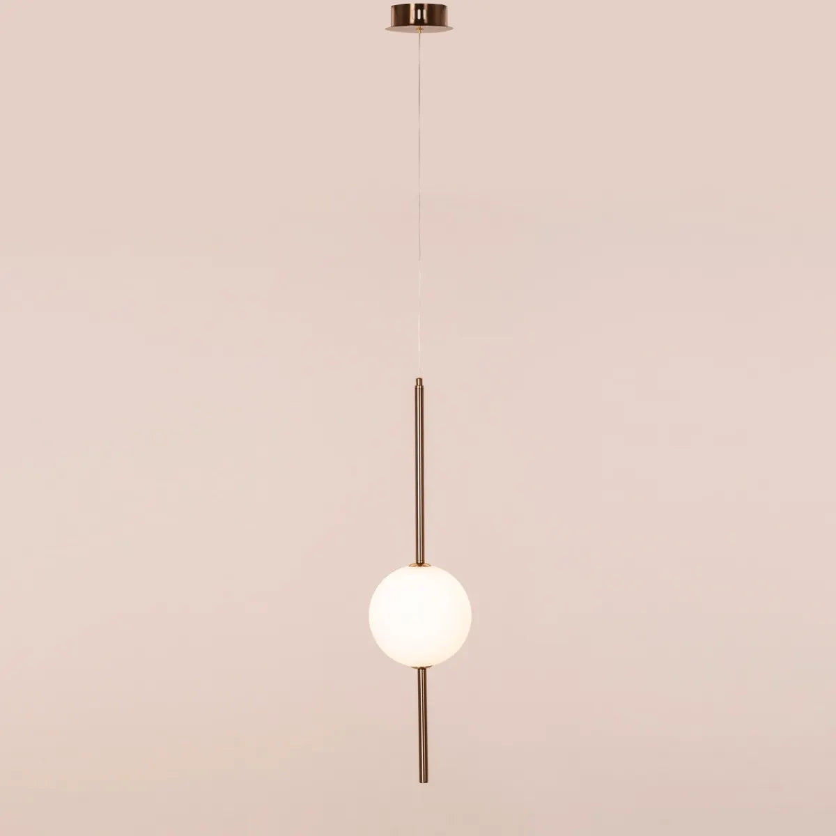 A modern pendant light named 'Peacemaker,' featuring a sleek gold finish and built-in LED lighting. The minimalist design showcases clean lines and a refined silhouette, while the integrated LED provides bright, energy-efficient illumination. This elegant pendant adds a touch of sophistication and warmth to any space, making it a perfect addition to contemporary decor