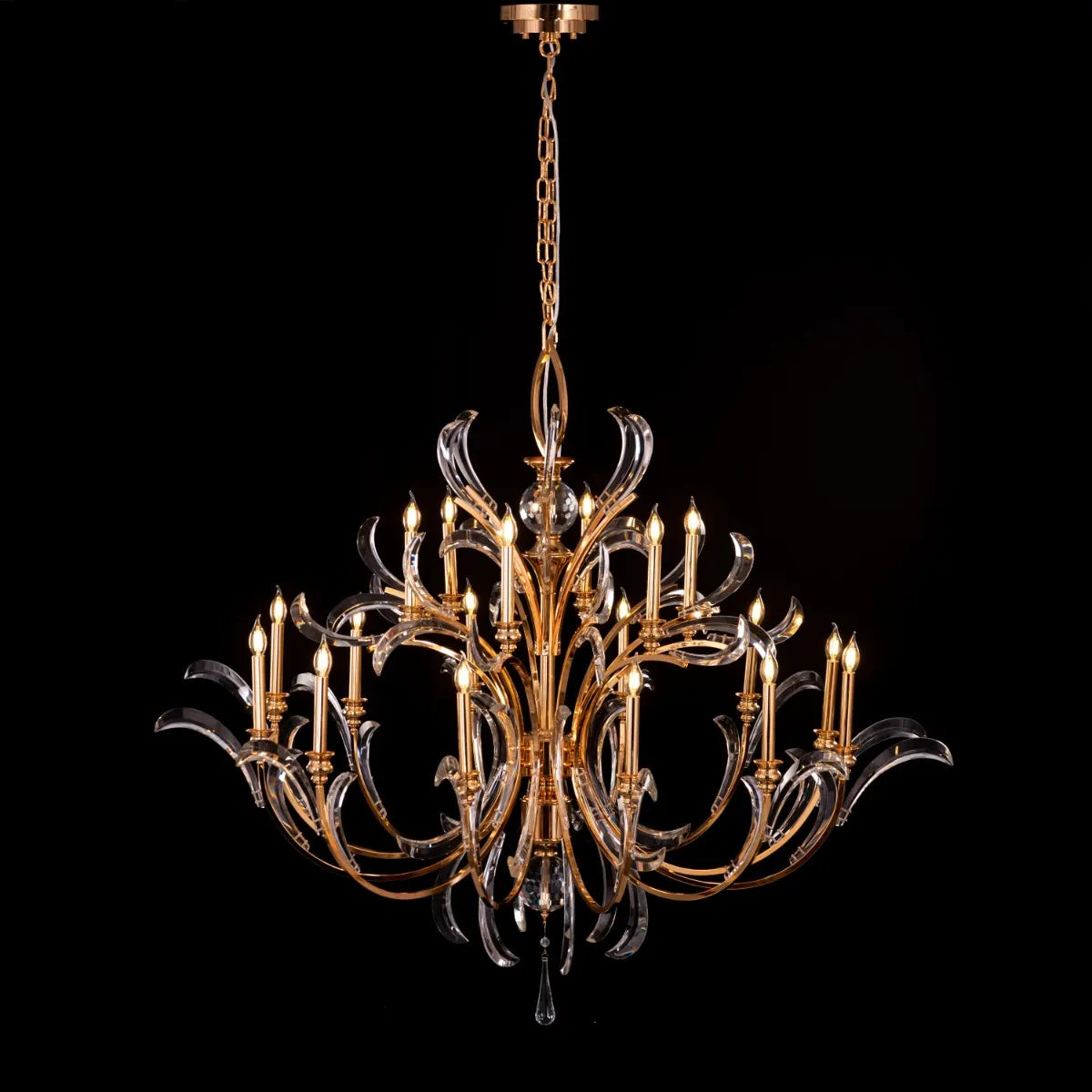 Large gold crystal chandelier with multiple tiers resembling a cascading fountain