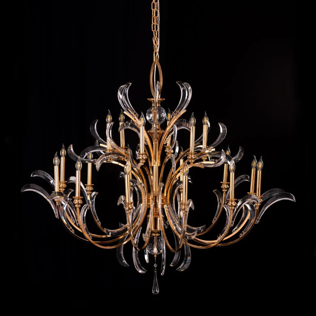 Large gold crystal chandelier with multiple tiers resembling a cascading fountain