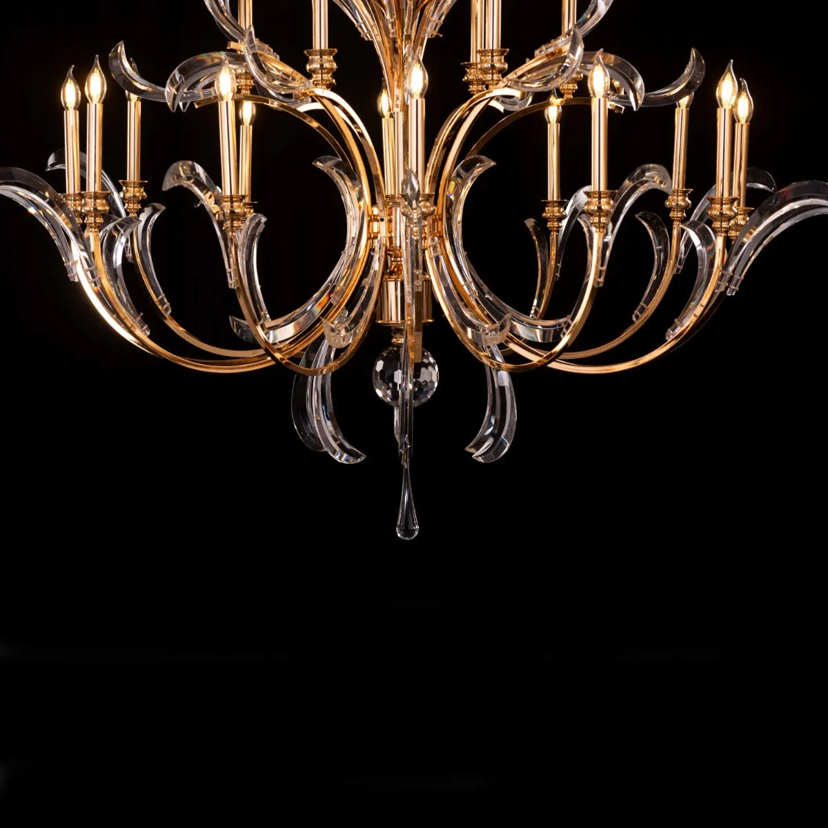 Large gold crystal chandelier with multiple tiers resembling a cascading fountain