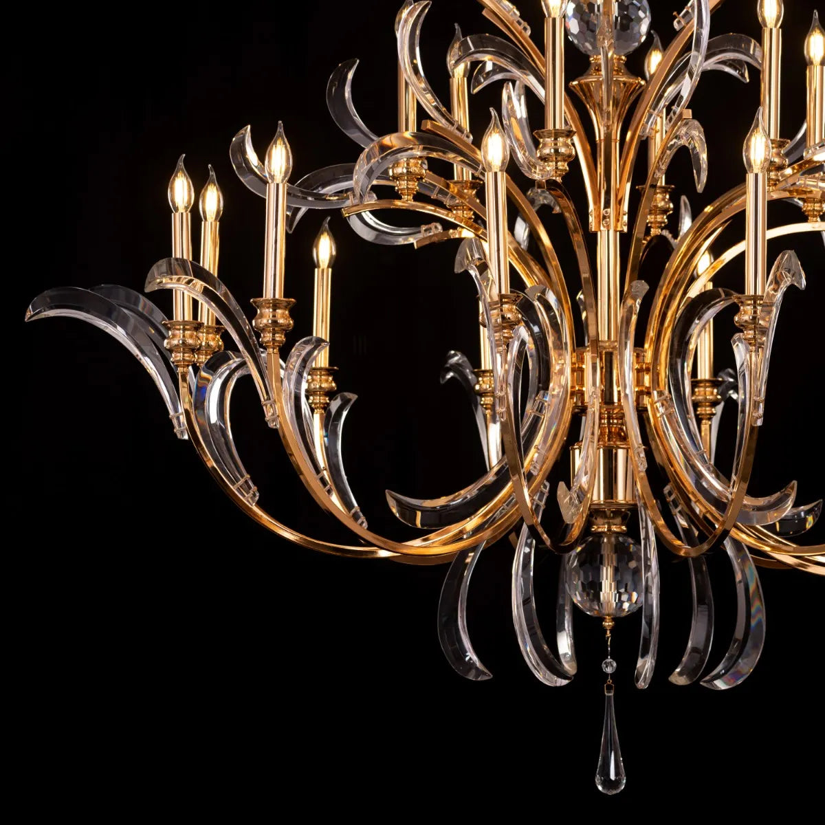 Large gold crystal chandelier with multiple tiers resembling a cascading fountain