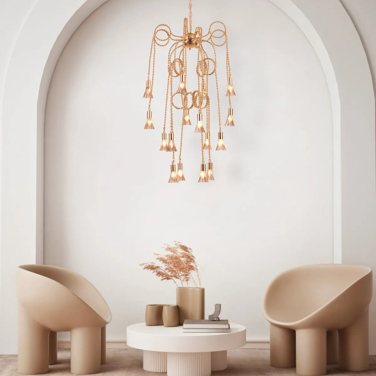 Wild Honey Chandelier with flowing golden arms illuminating a dining room.