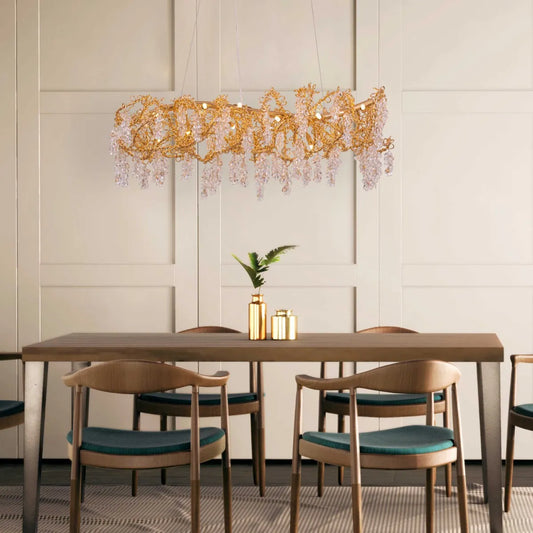 Believe In Magic large gold crystal chandelier illuminating an elegant living room