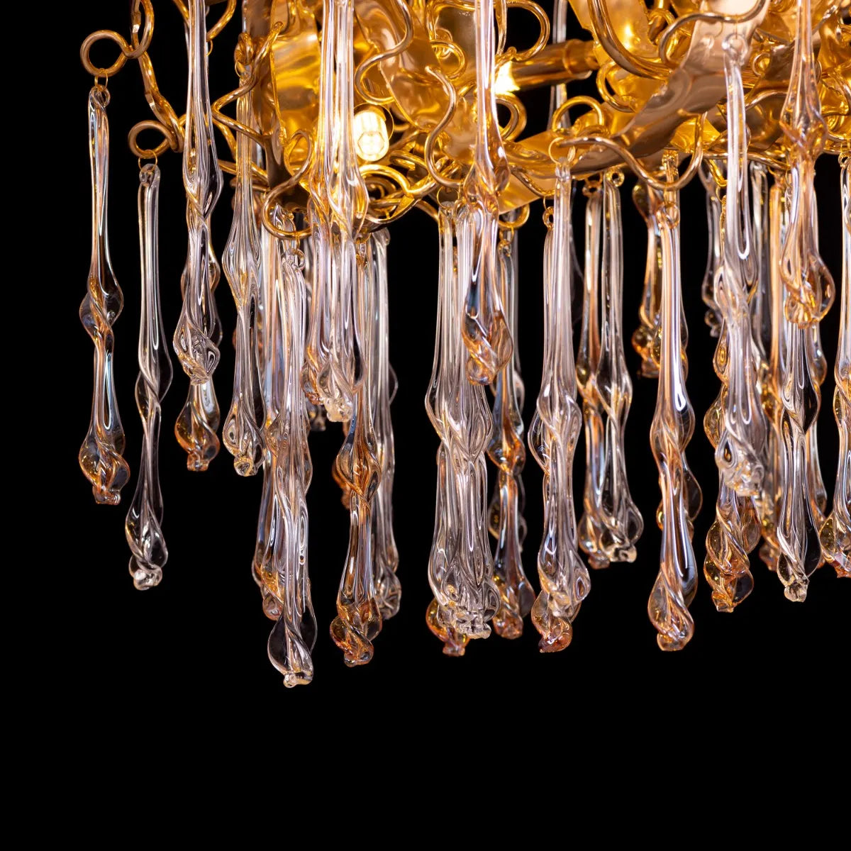 Medium-sized amber crystal chandelier with two layers resembling a golden galaxy