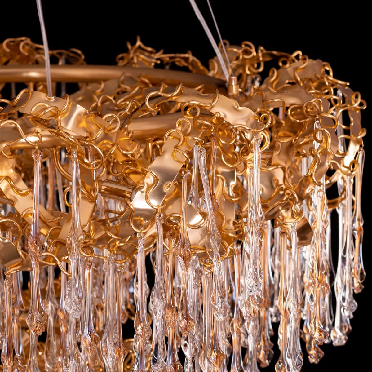 Medium-sized amber crystal chandelier with two layers resembling a golden galaxy