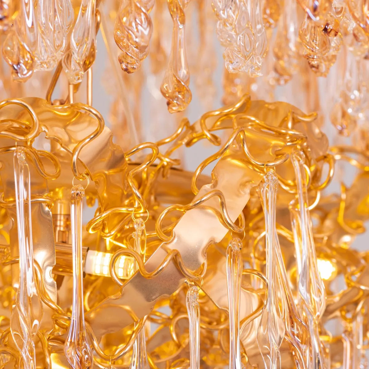 Large gold 3-layer crystal chandelier resembling a sparkling galaxy