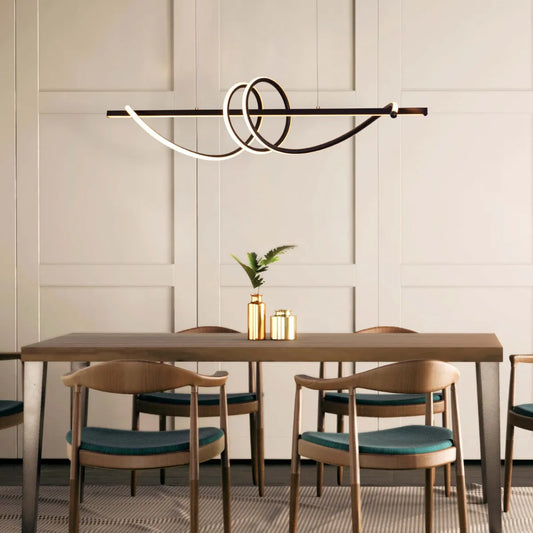 Up In The Air Chandelier suspended in a modern living room, its black elements contrasting dramatically with warm white light.