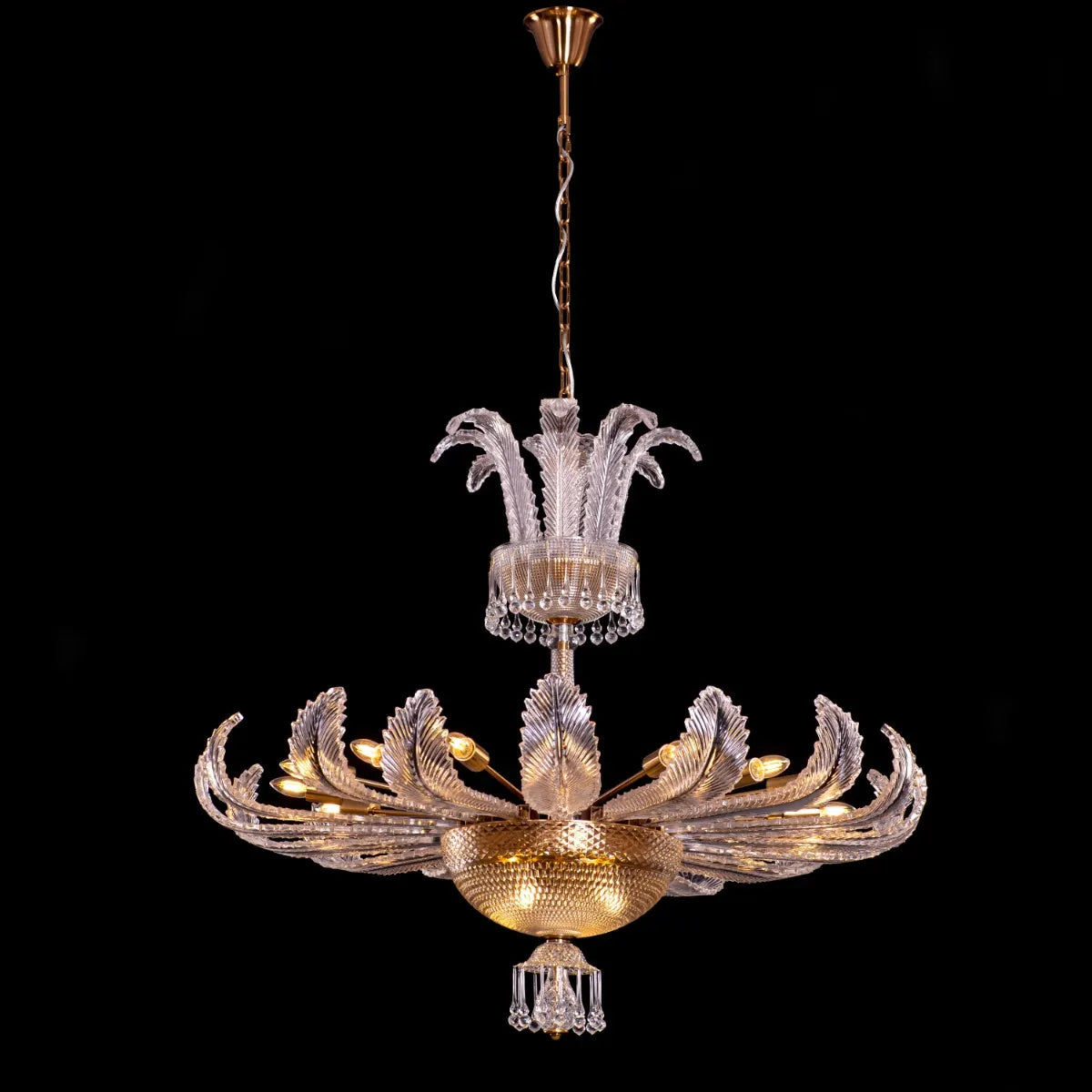 Large gold crystal chandelier with intricate design, hanging in an opulent room