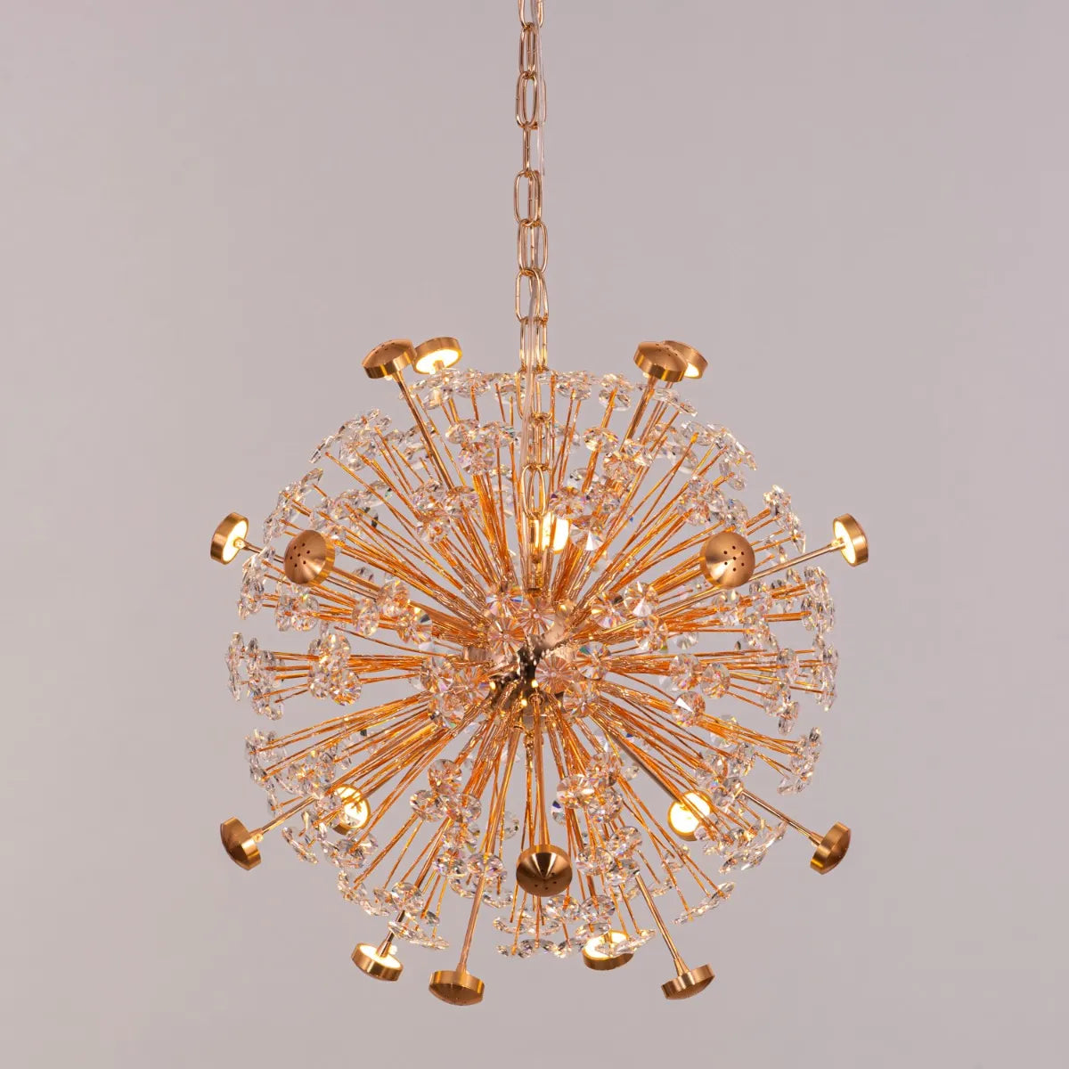 Soaring Signature crystal chandelier illuminating a grand, open-concept living space