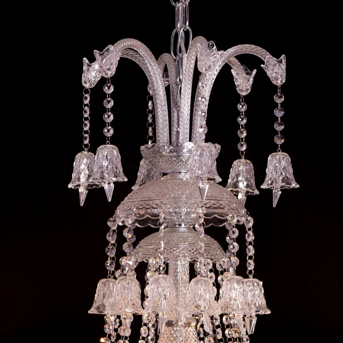 Large chrome Rules The Room Grand crystal chandelier illuminating a luxurious hotel lobby with dazzling brilliance