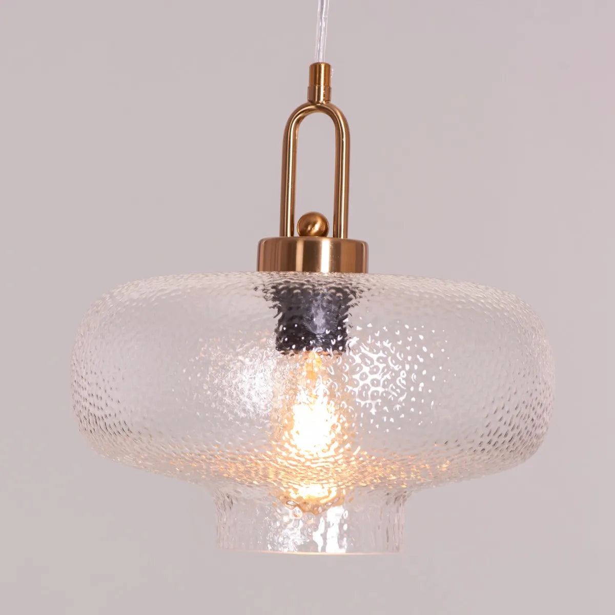 Modern Take Me Traveling Pendant Light with Stout Textured Glass and Elegant Gold Detailing