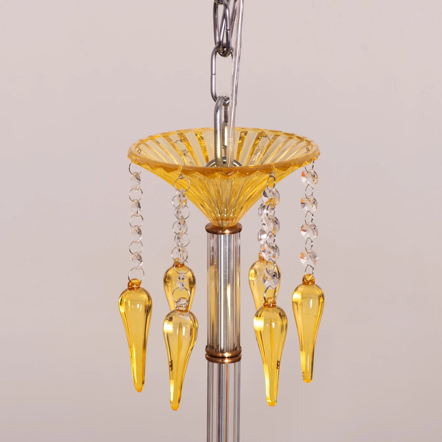 Large gold Wealthy Not Rich crystal chandelier illuminating a grand foyer with sparkling brilliance