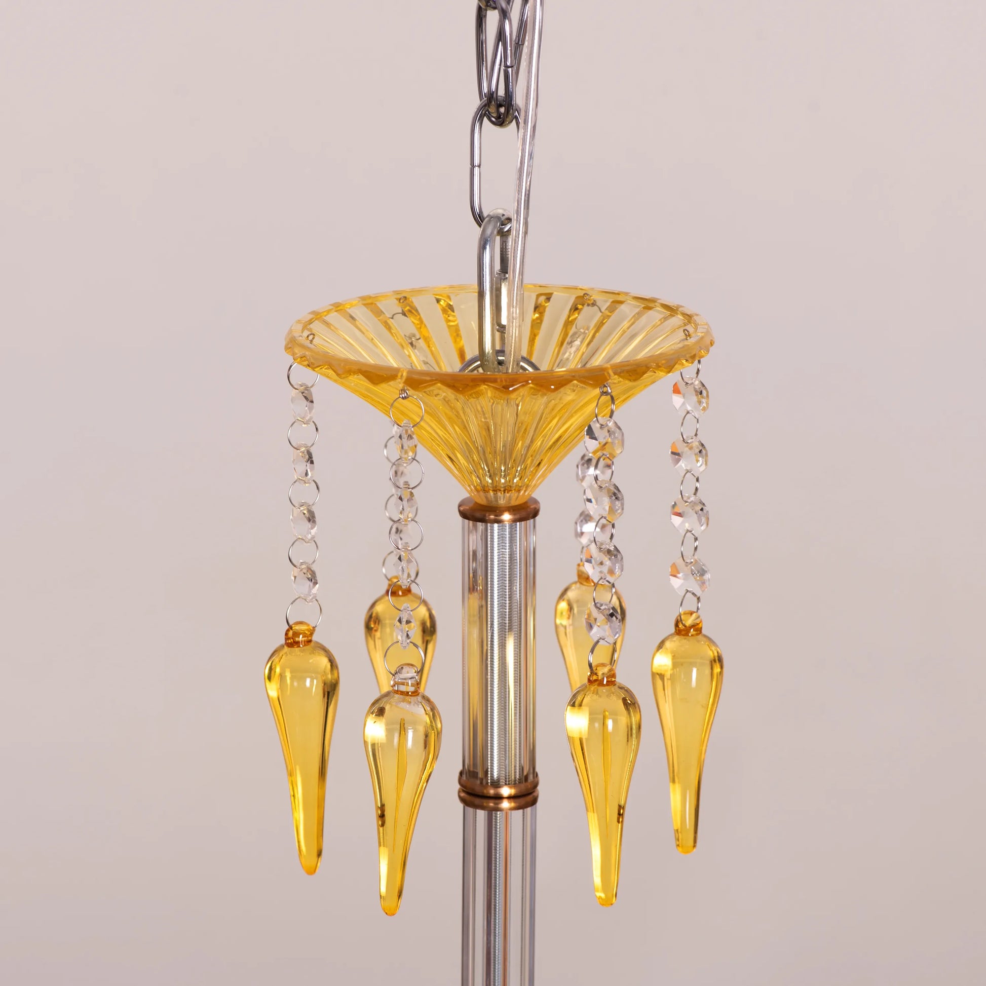 Large gold Wealthy Not Rich crystal chandelier illuminating a grand foyer with sparkling brilliance