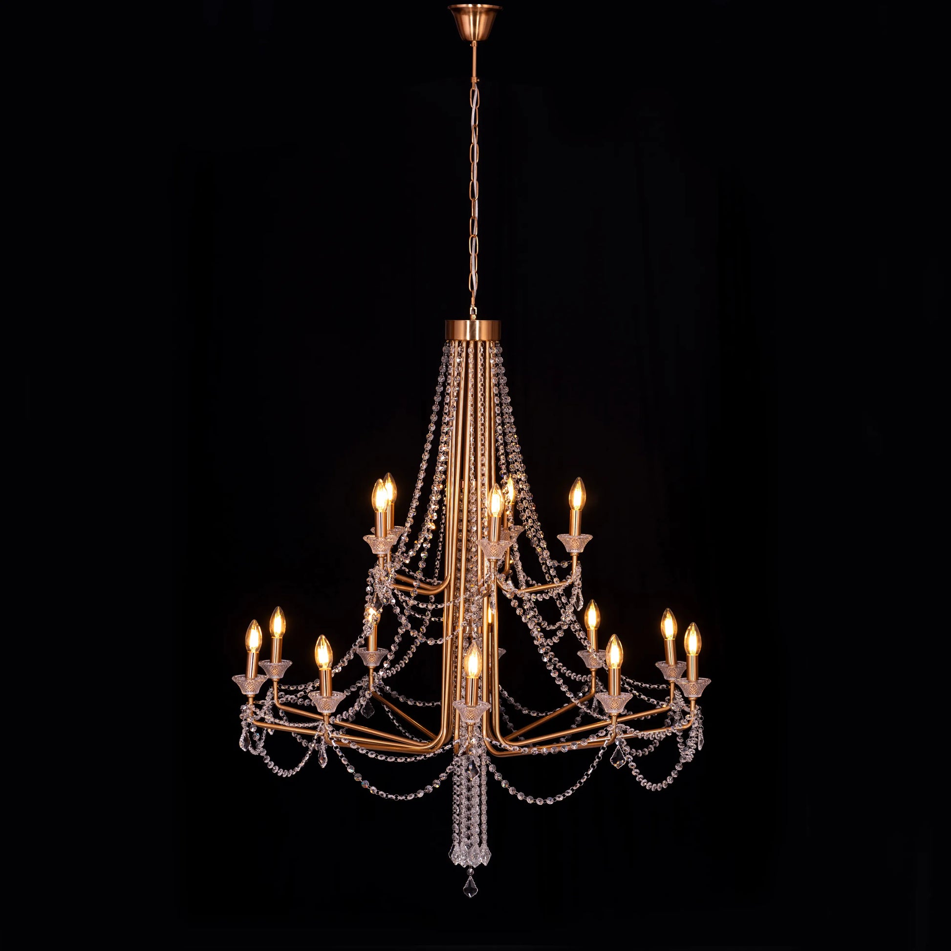 Large gold Add The Frosting crystal chandelier illuminating a grand ballroom with dazzling brilliance