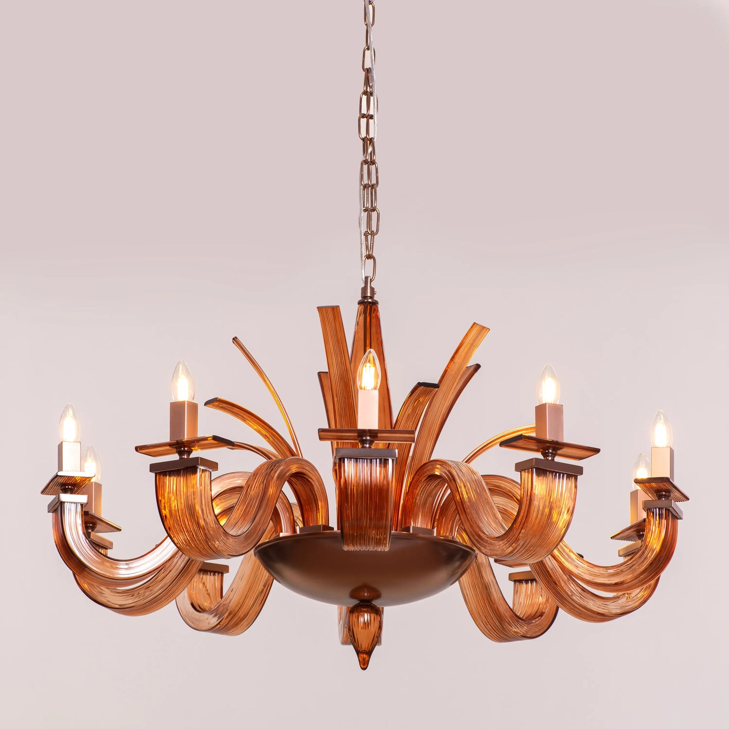 Large brown textured glass chandelier with overlapping layers creating a velvet-like appearance