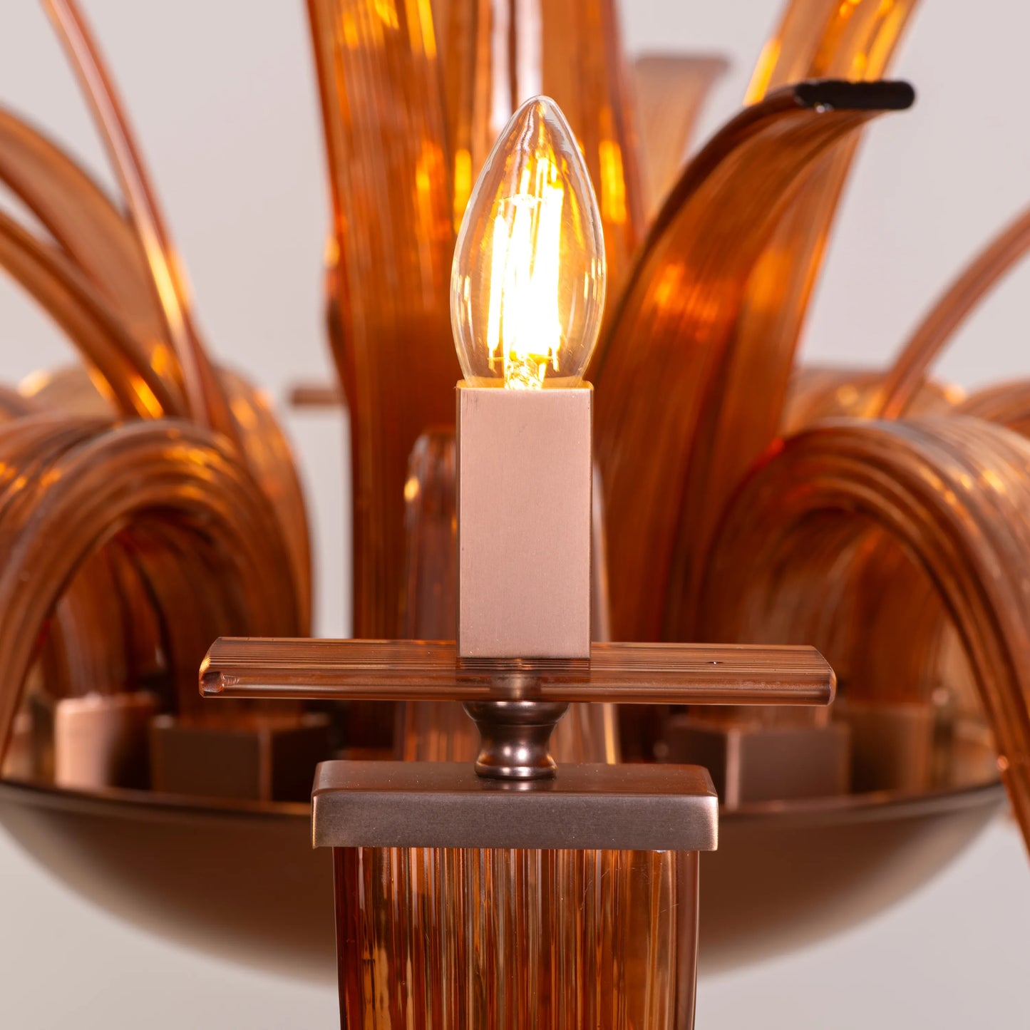 Large brown textured glass chandelier with overlapping layers creating a velvet-like appearance