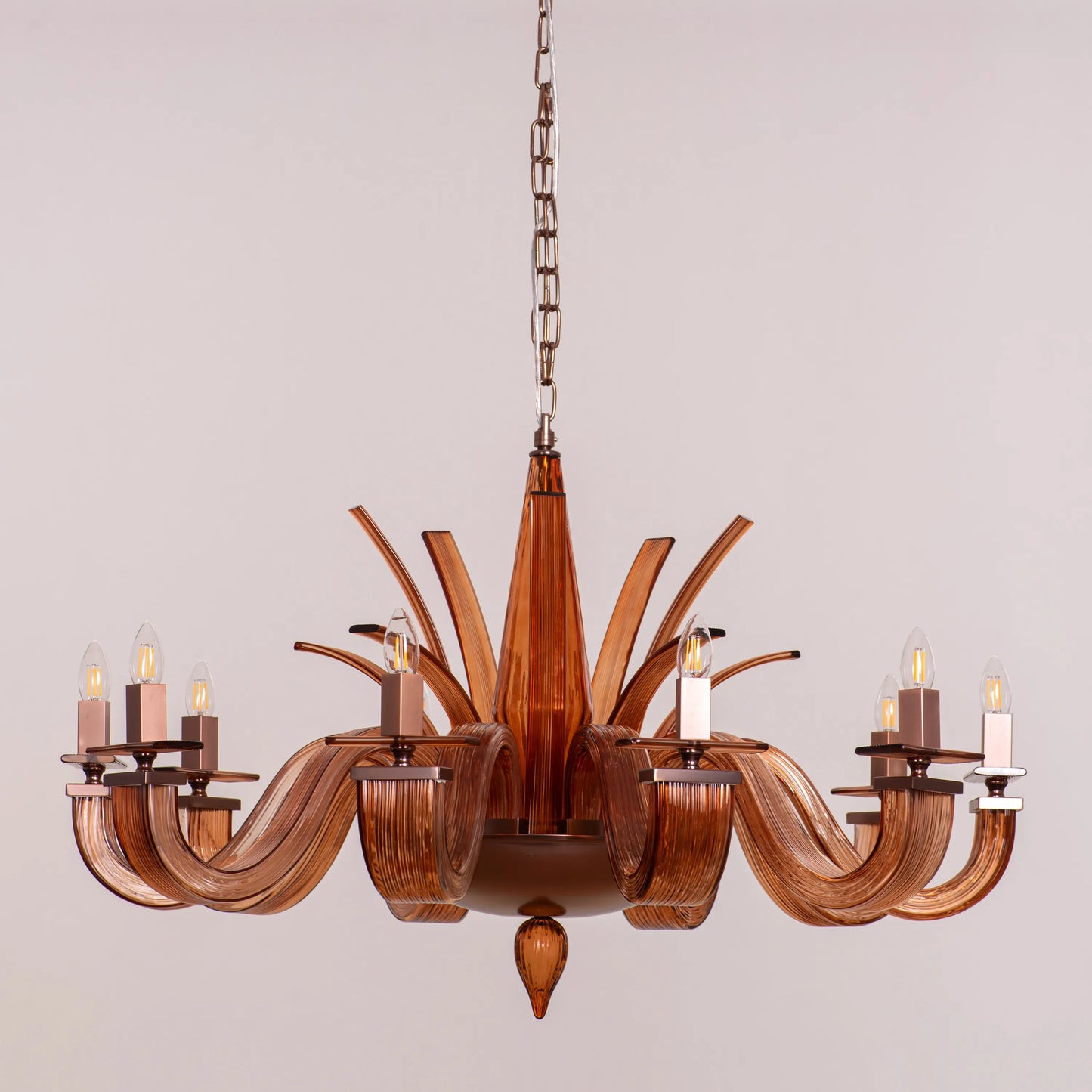 Large brown textured glass chandelier with overlapping layers creating a velvet-like appearance