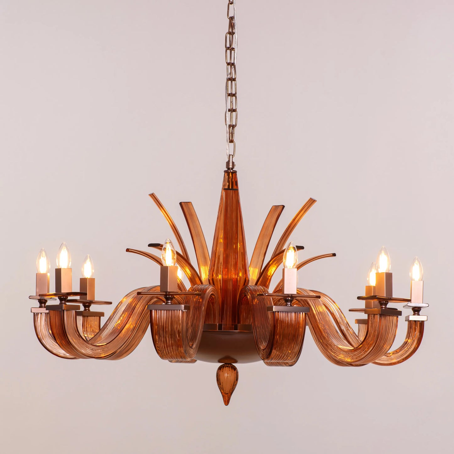 Large brown textured glass chandelier with overlapping layers creating a velvet-like appearance