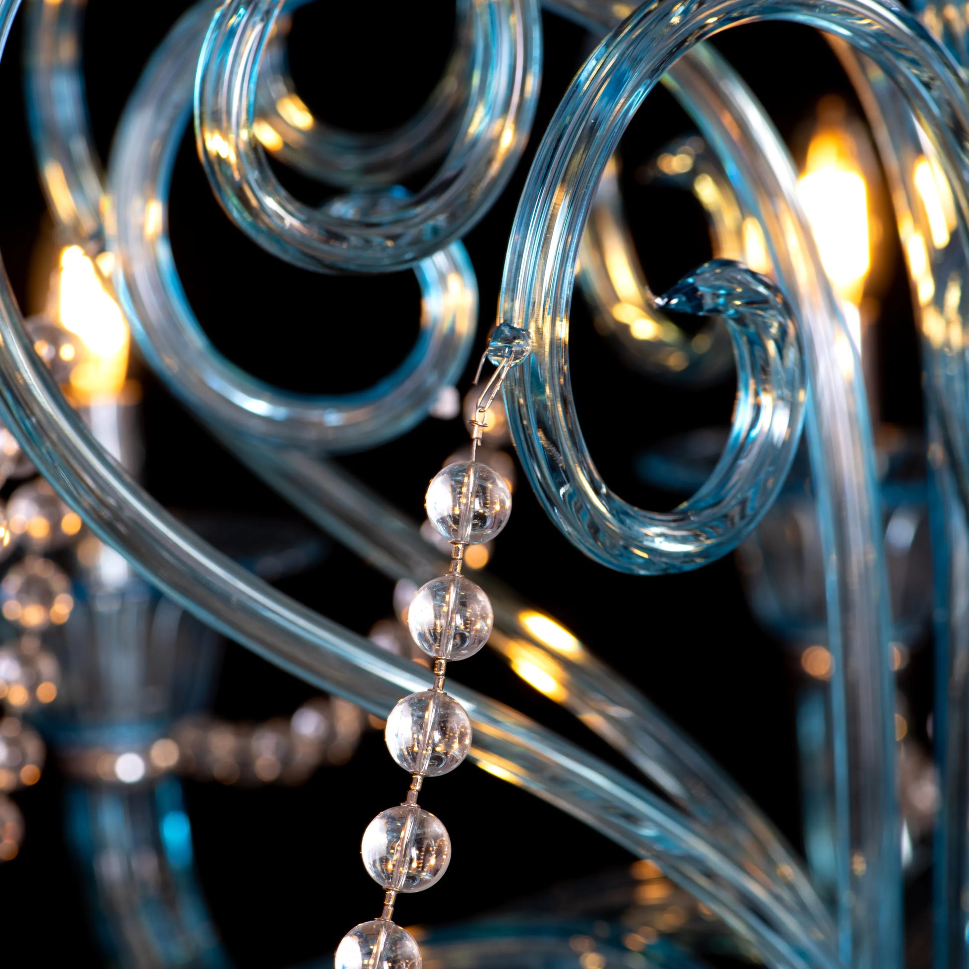 Grecian Glamour large blue textured glass chandelier illuminating a luxurious living room