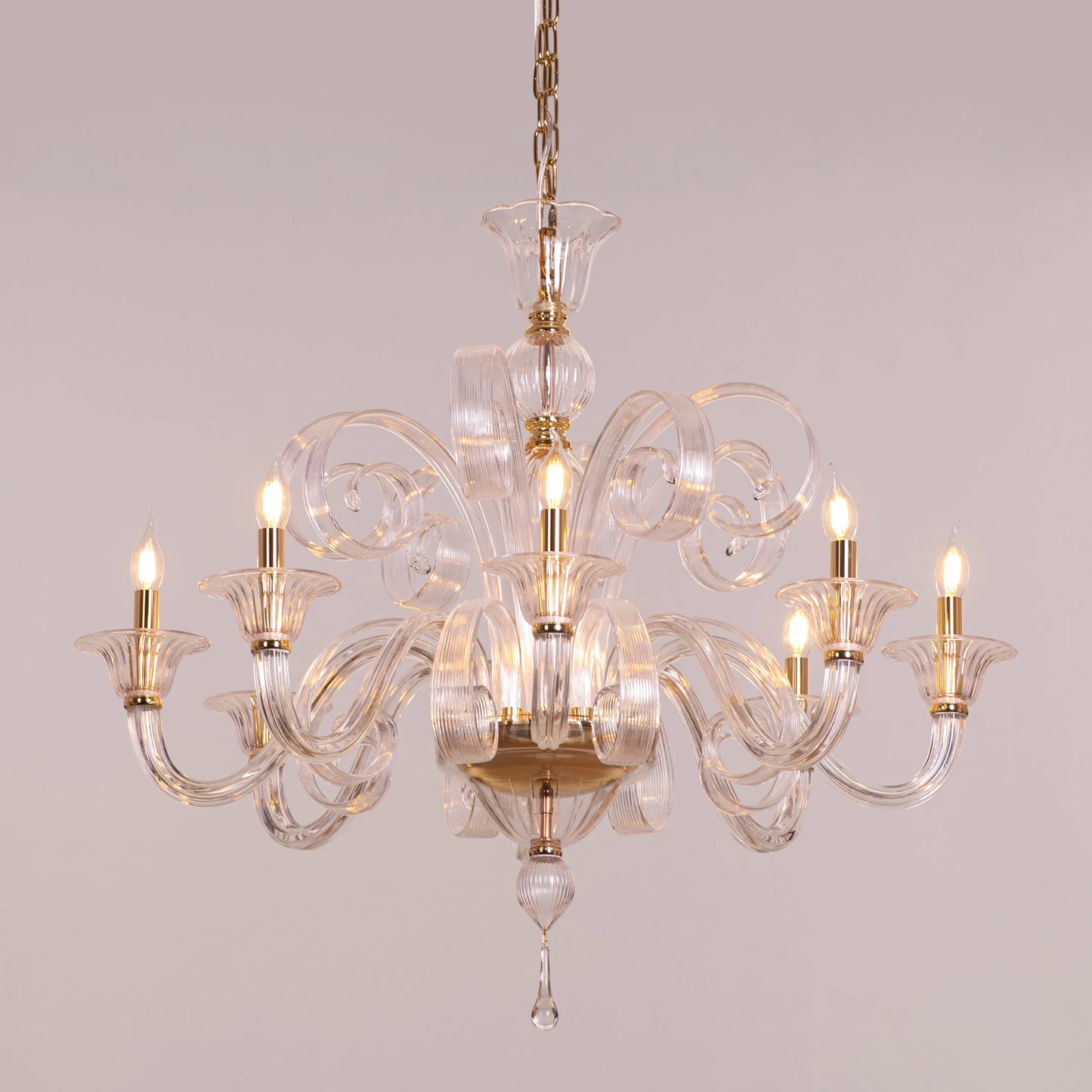 Large gold chandelier with cascading textured glass