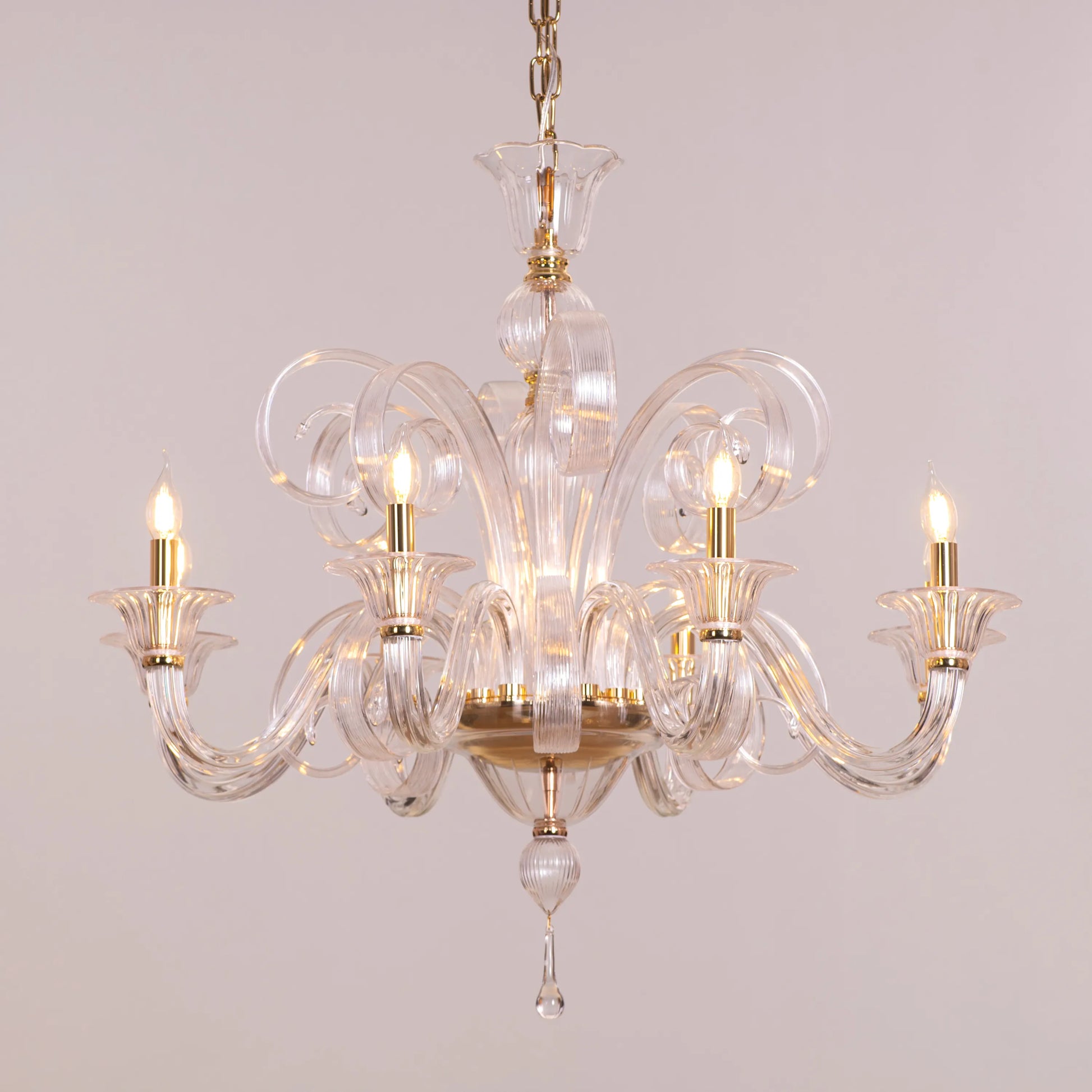 Large gold chandelier with cascading textured glass