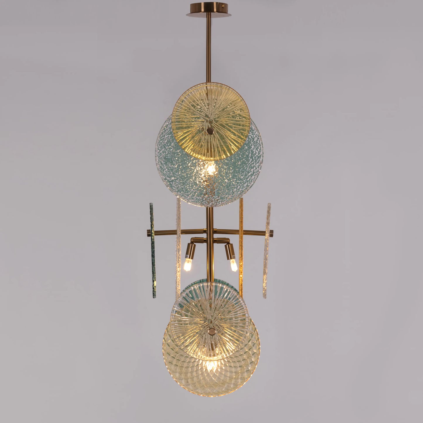 Trendsetter medium gold chandelier illuminating a modern living room with its avant-garde design