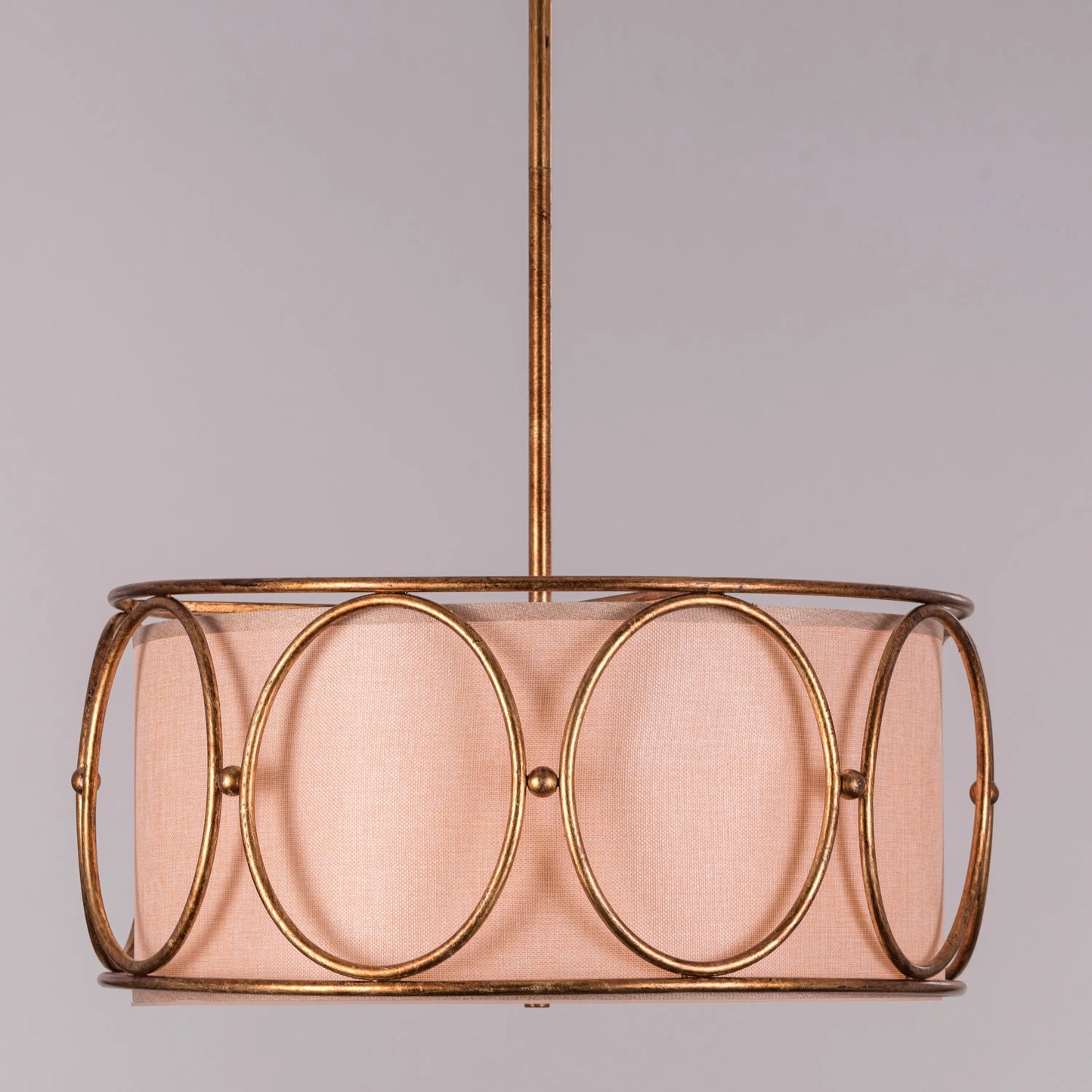 A sophisticated pendant light named 'Play Our Song,' featuring a stunning gold foil gilded finish that exudes elegance and luxury. The light's design incorporates smooth curves and a modern silhouette, enhancing its artistic appeal. When illuminated, the gold foil creates a warm, inviting glow, making it a perfect centerpiece for adding glamour and style to any room