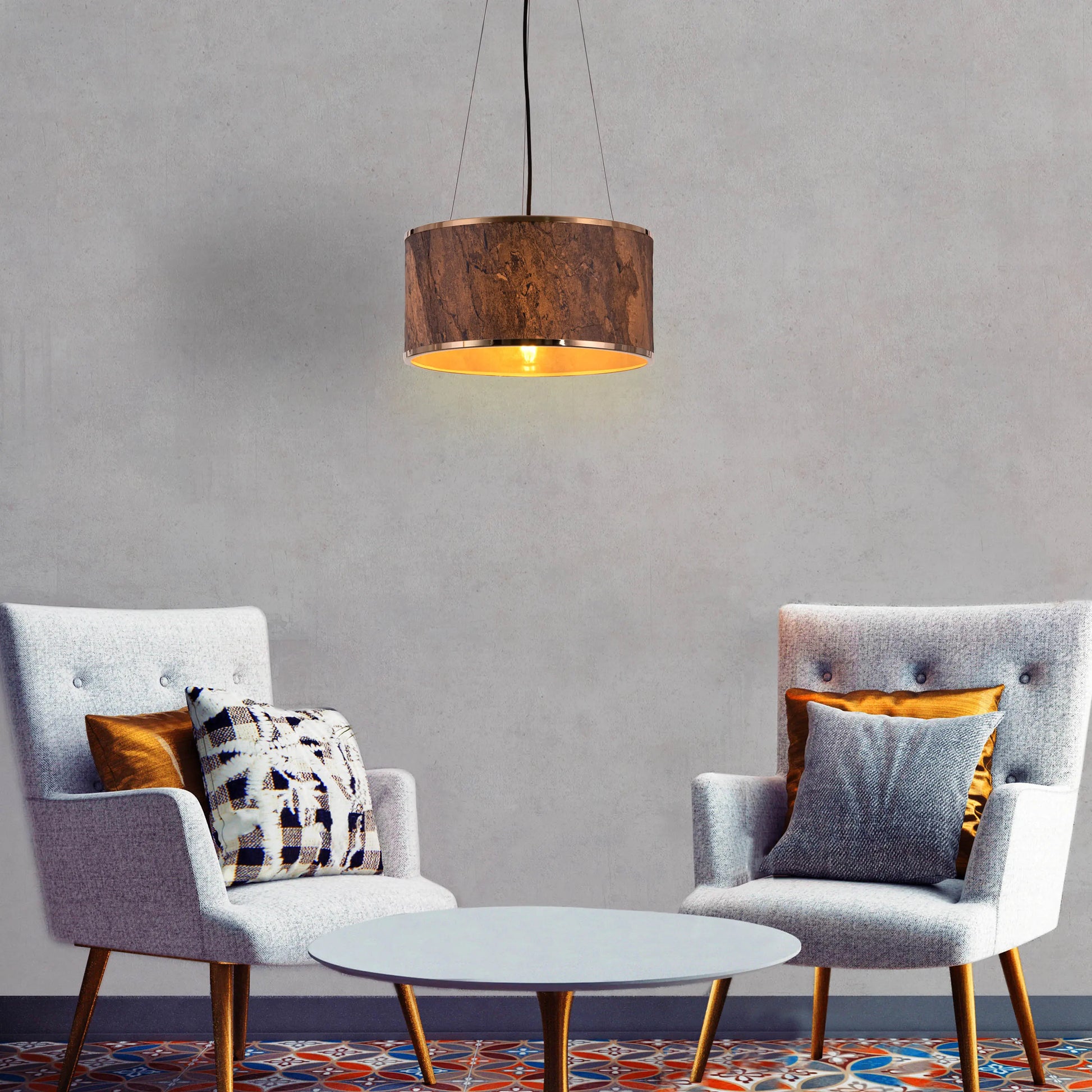 A contemporary pendant light named 'Touch & Glow,' featuring a striking gold stone veneer shade. The light's sleek design showcases the natural texture of the stone, beautifully reflecting and diffusing light to create a warm, inviting ambiance. This pendant light adds a touch of luxury and sophistication, making it an ideal choice for modern interiors.