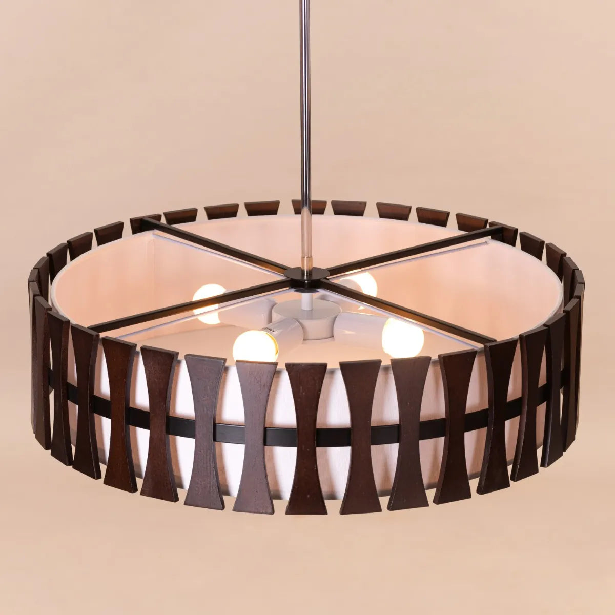 A warm and inviting pendant light named 'Positive Energy,' featuring a natural wooden shade with clean, minimalist lines. The wood’s organic texture and warm tones enhance the light's cozy glow, creating a peaceful and earthy ambiance. Its simple yet elegant design brings a touch of nature and tranquility to any space.