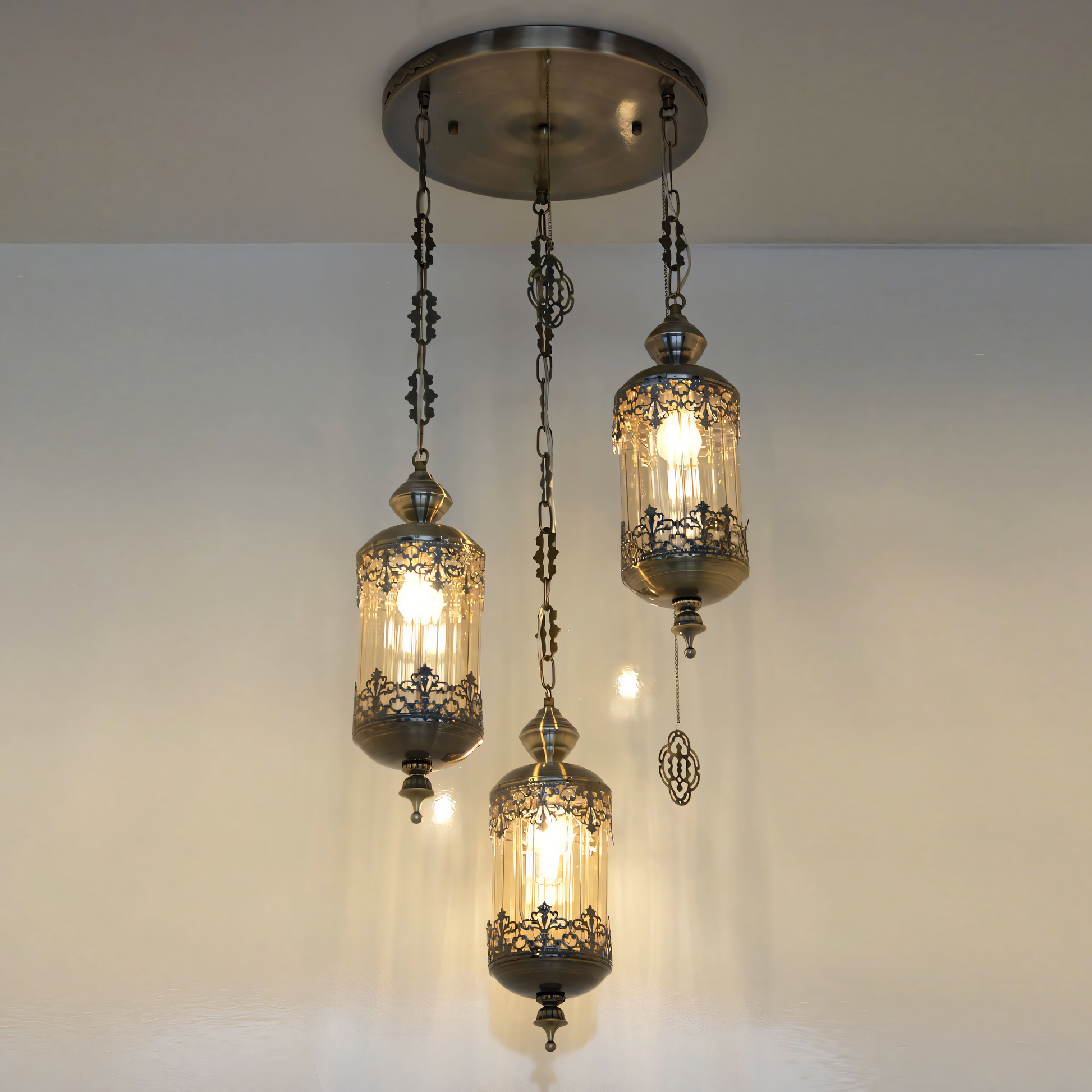 Ornate Moroccan-inspired metal hanging light with amber-toned glass panels