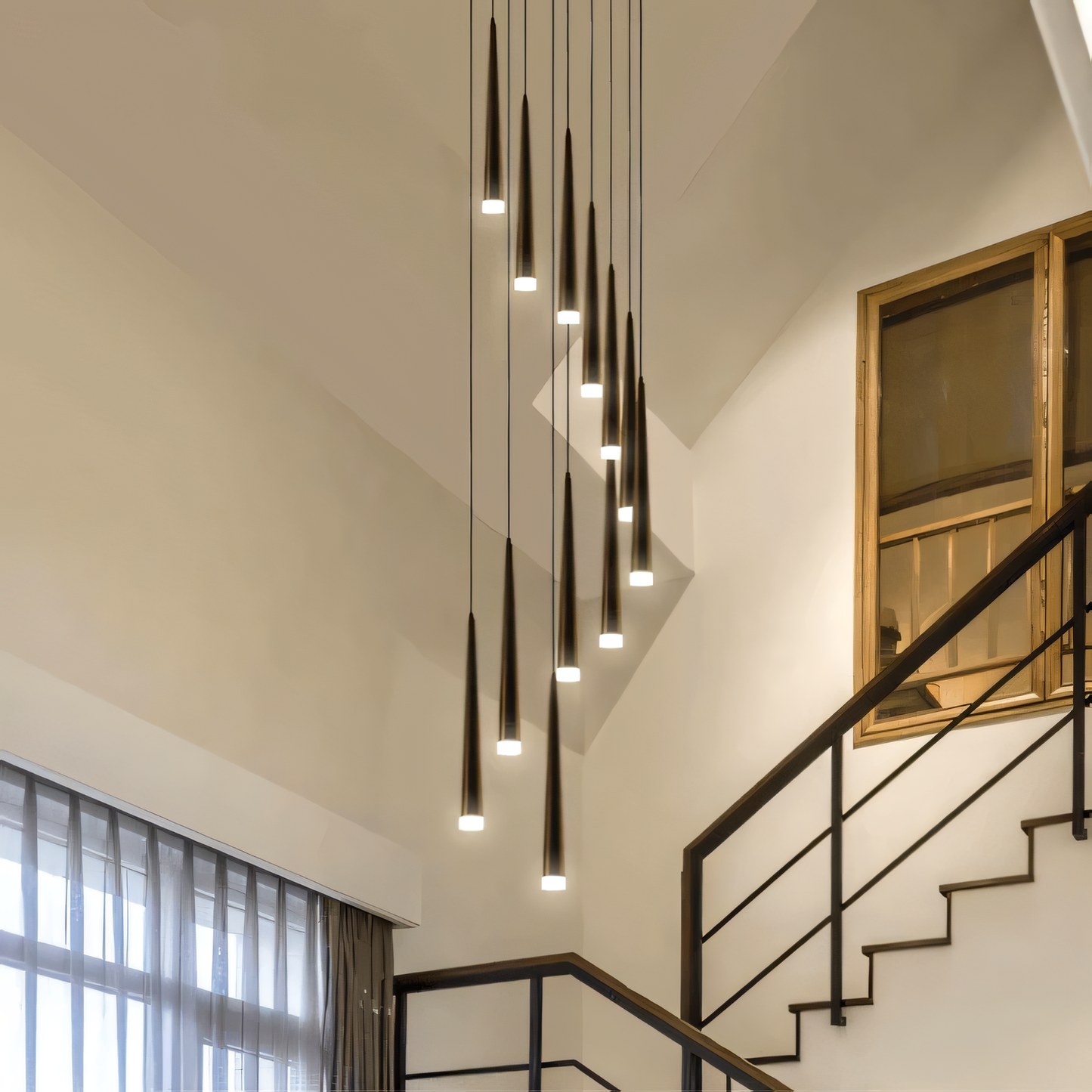 The Pluviam Sense Long Chandelier casts a soft, sparkling glow on a modern living space.