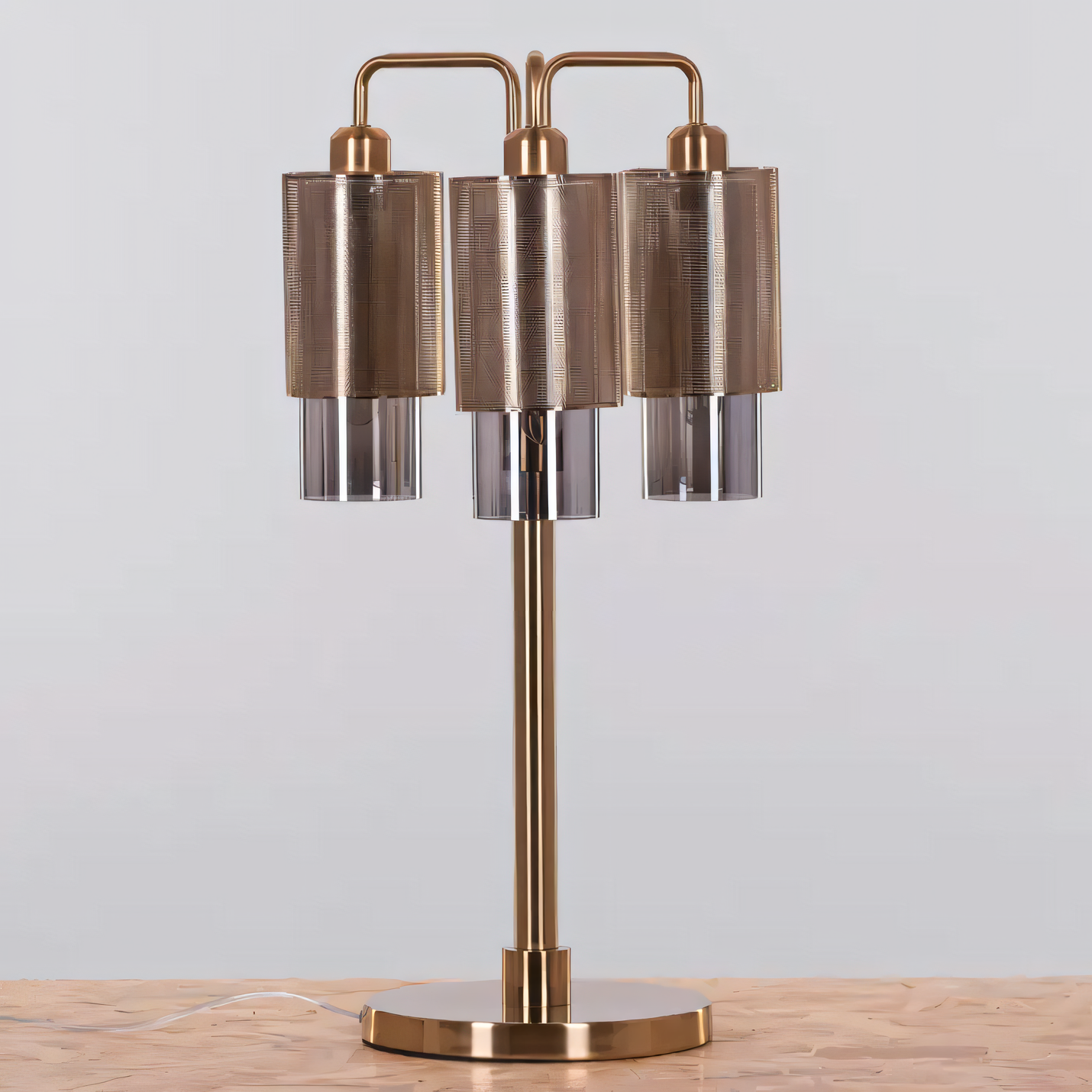 Smokey grey glass shade of the Attention Seeker (Gold) Table Lamp