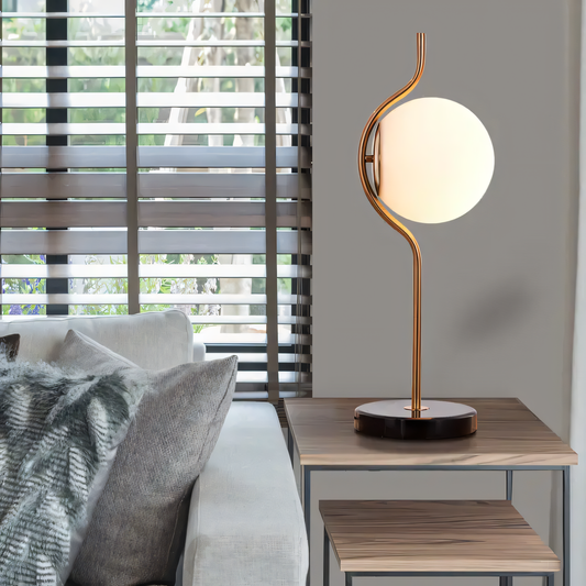 Crane-inspired table lamp with marble base and gold finish